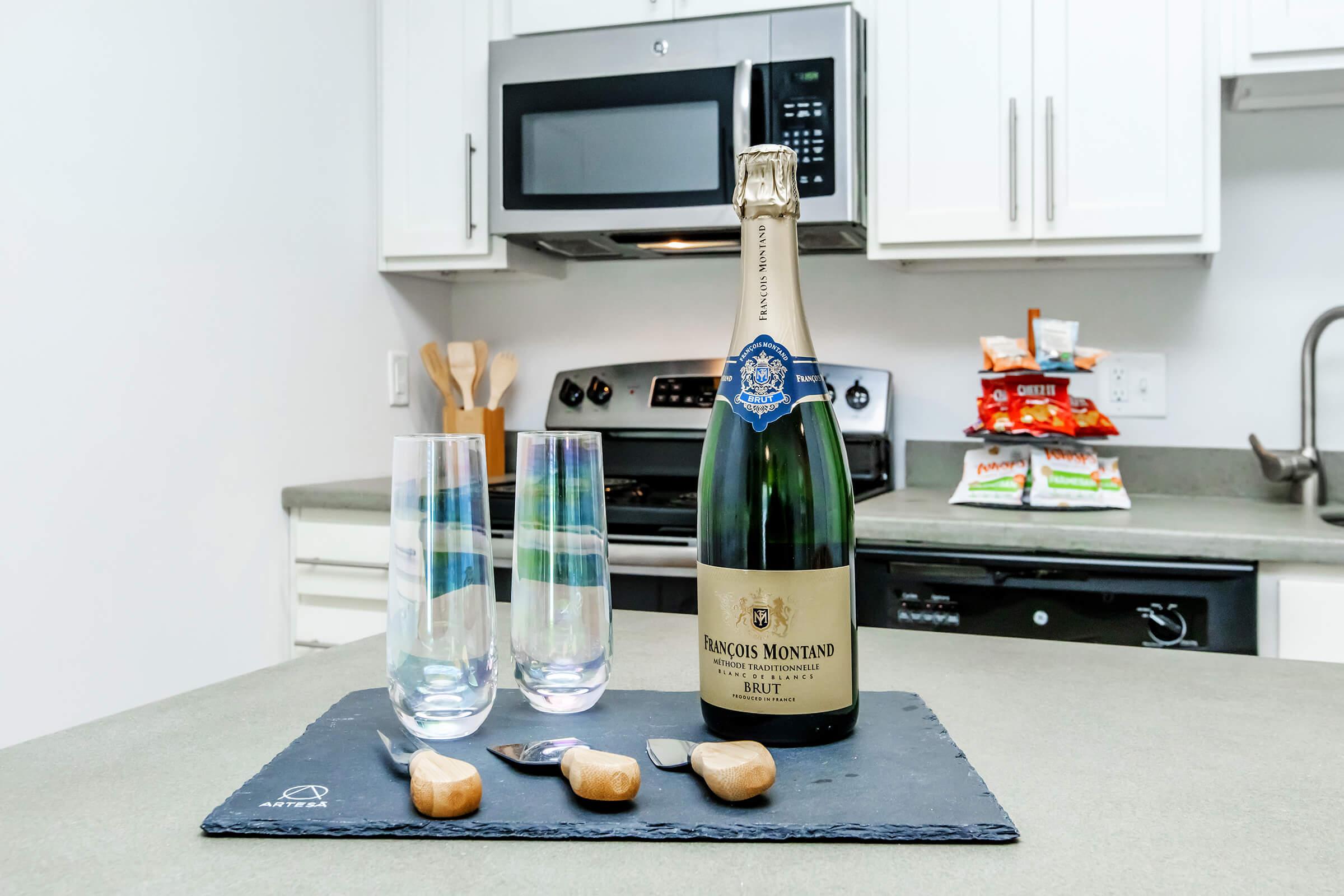 a bottle of water on a kitchen counter