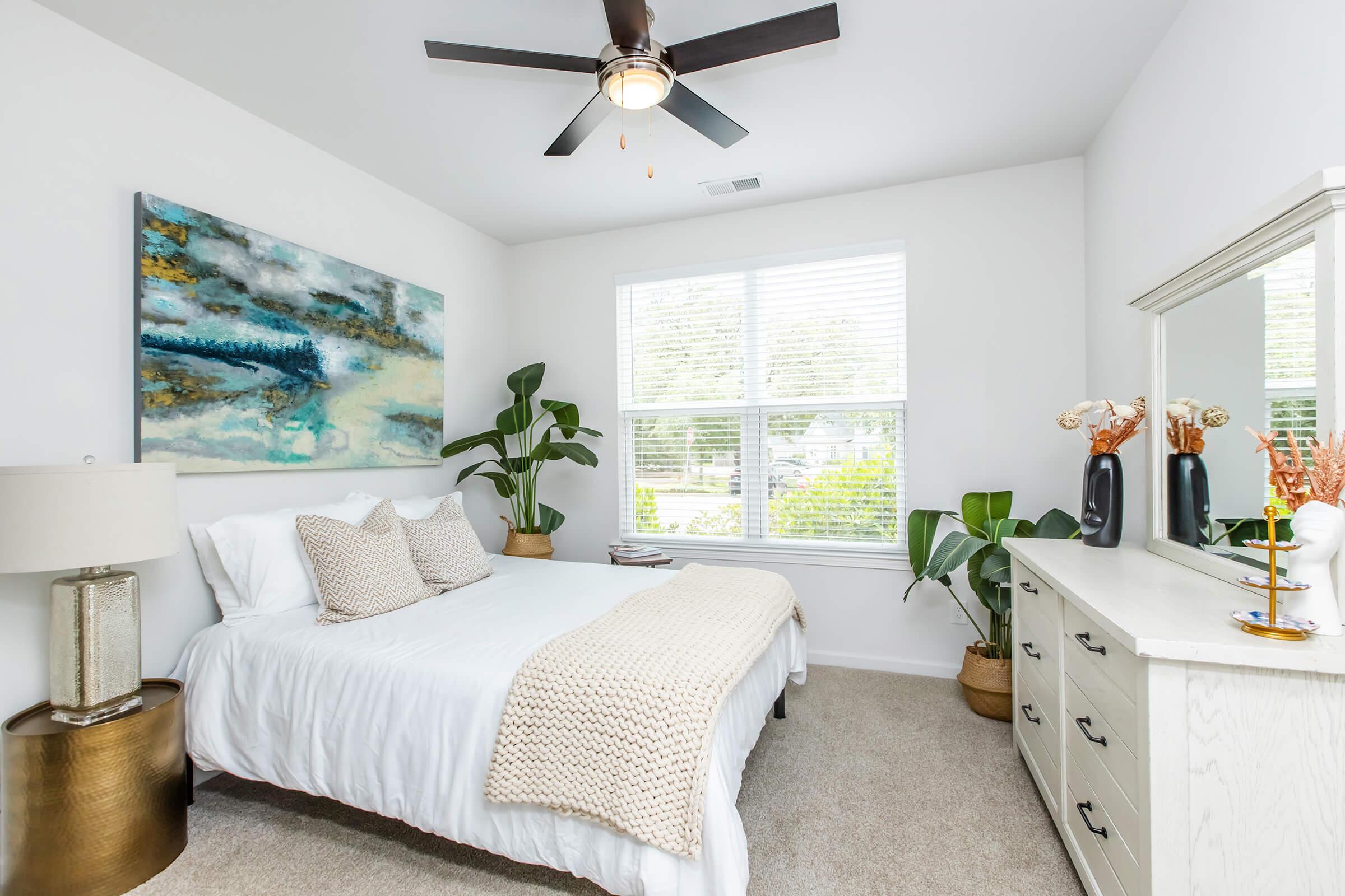 a bedroom with a large bed in a room