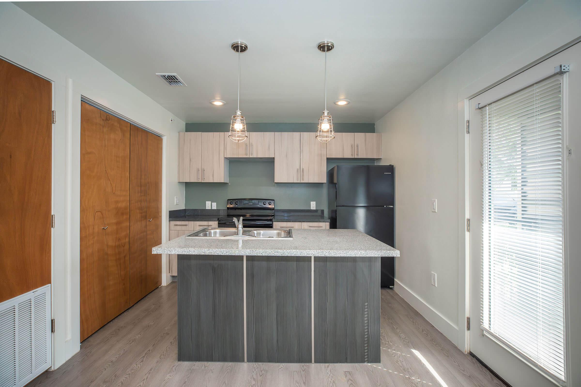 a kitchen with a wood floor