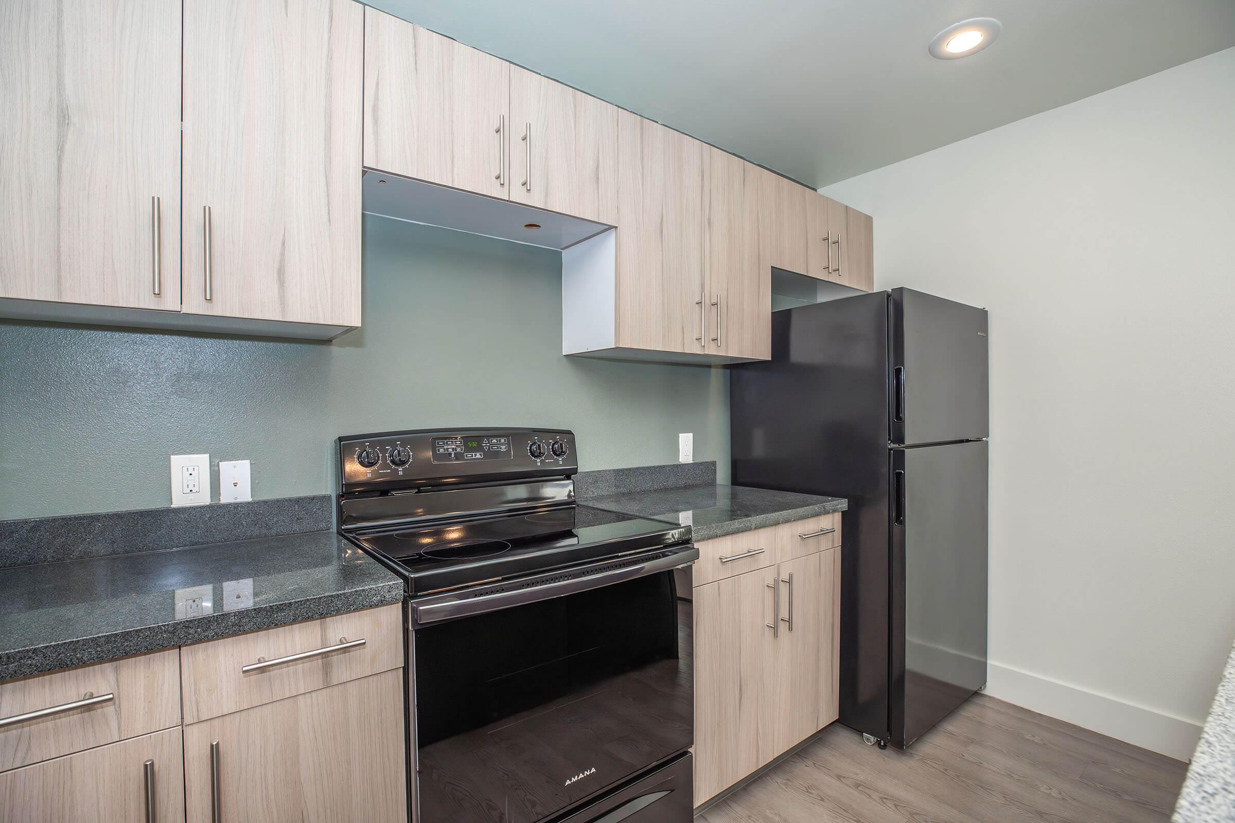 a large kitchen with stainless steel appliances