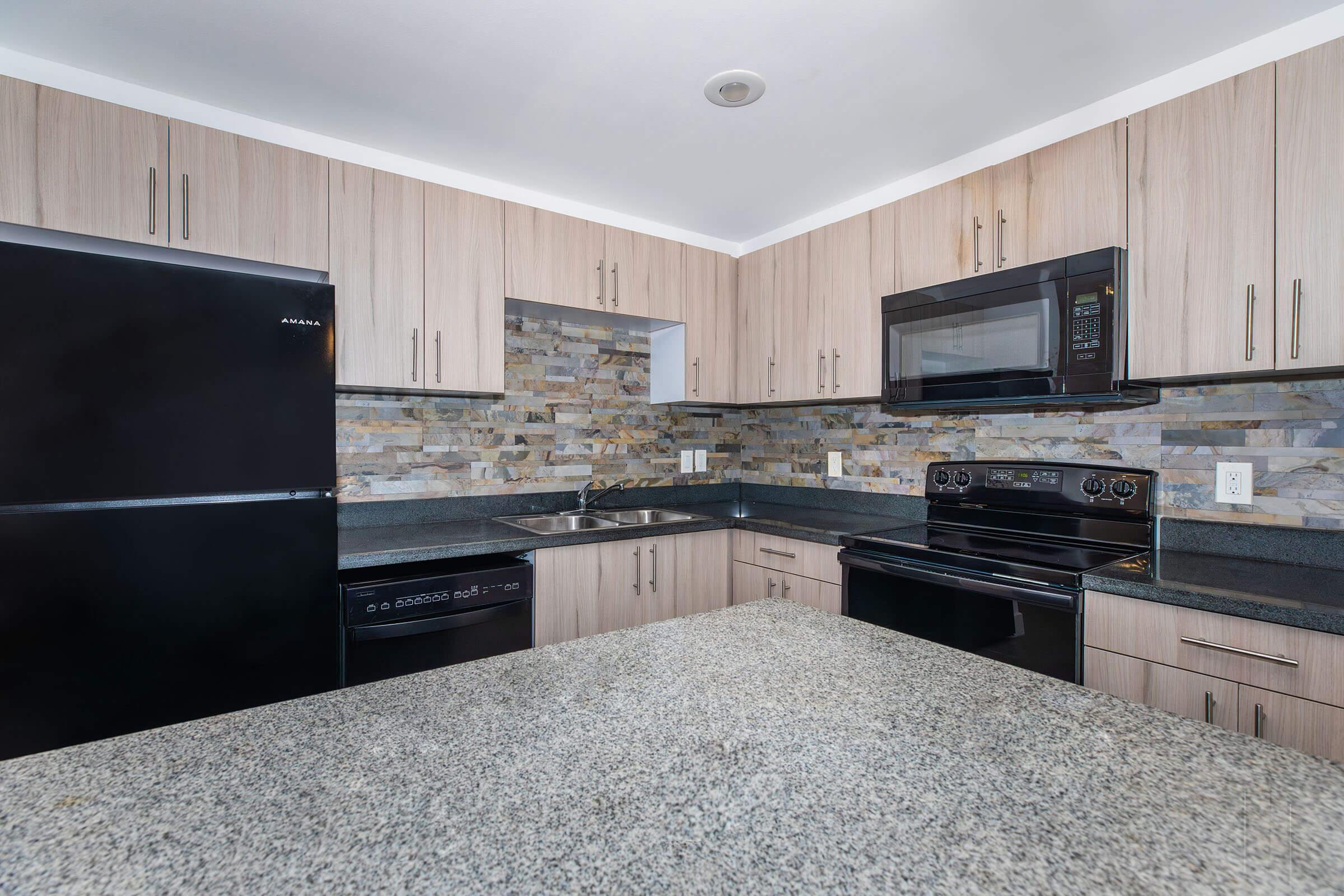 a modern kitchen with stainless steel appliances