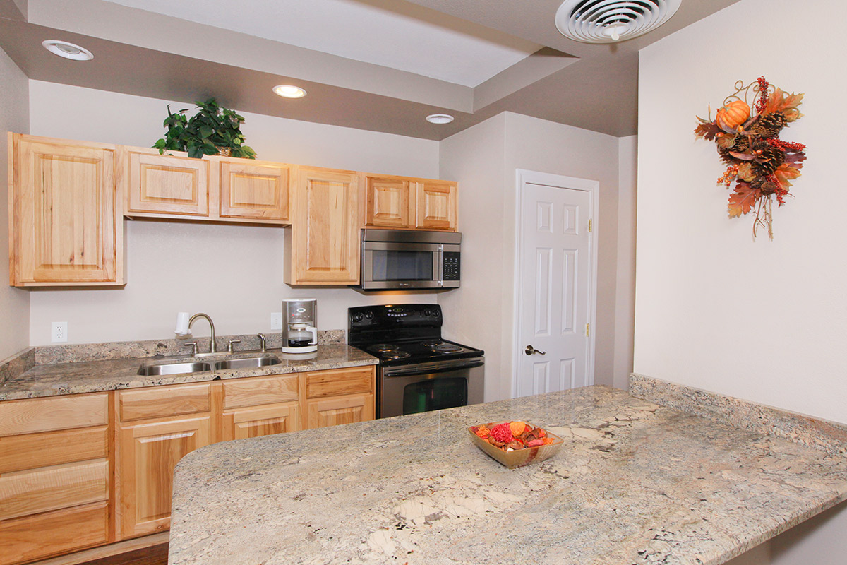 a kitchen with an island in the middle of a room