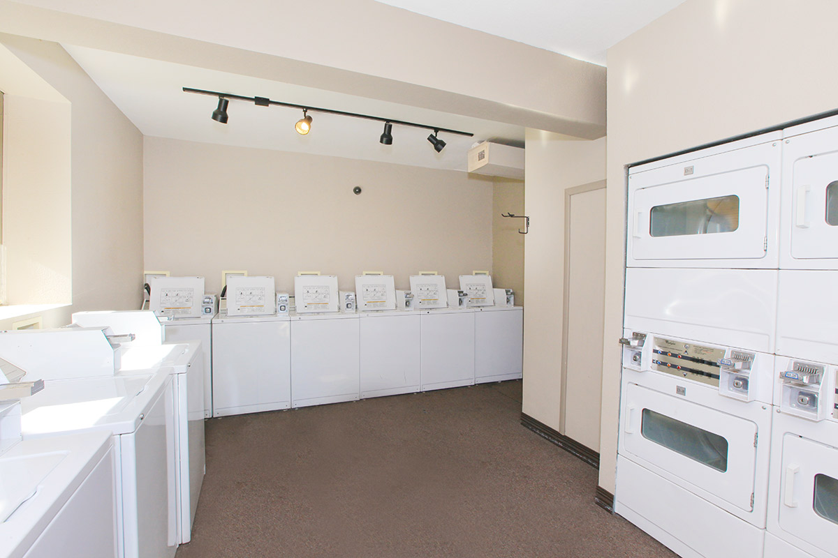 a large kitchen with white cabinets