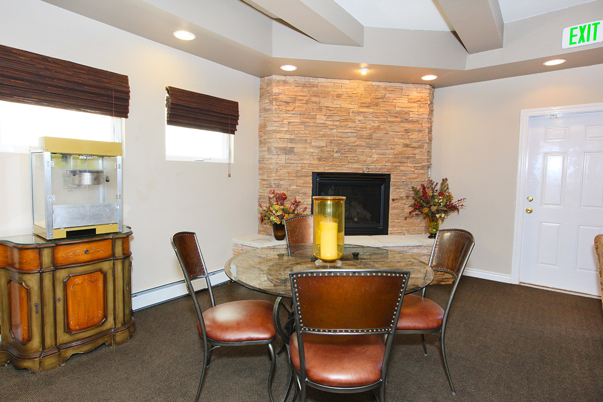 a living room filled with furniture and a fireplace