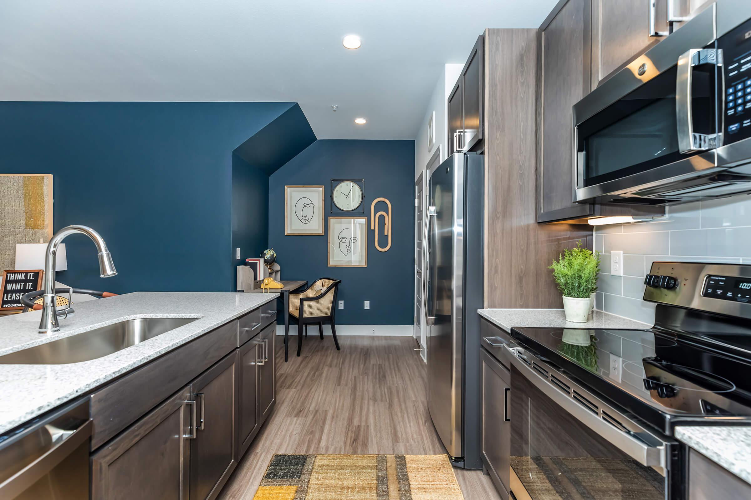 a modern kitchen with stainless steel appliances