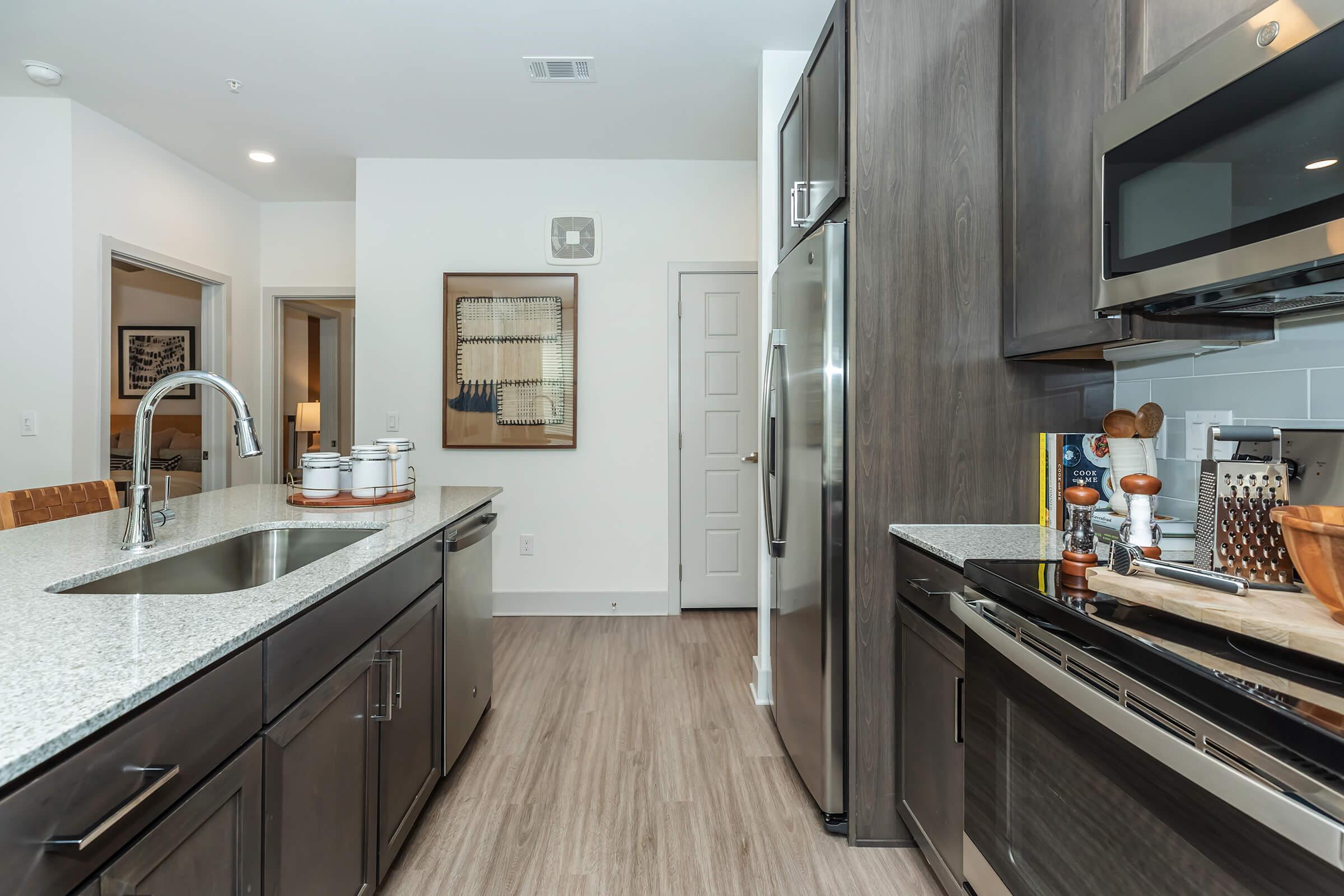 a kitchen with an island in the middle of a room