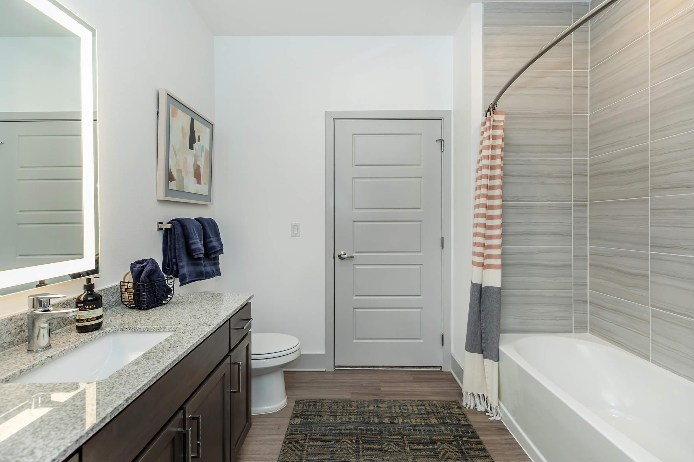 a kitchen with a sink and a mirror