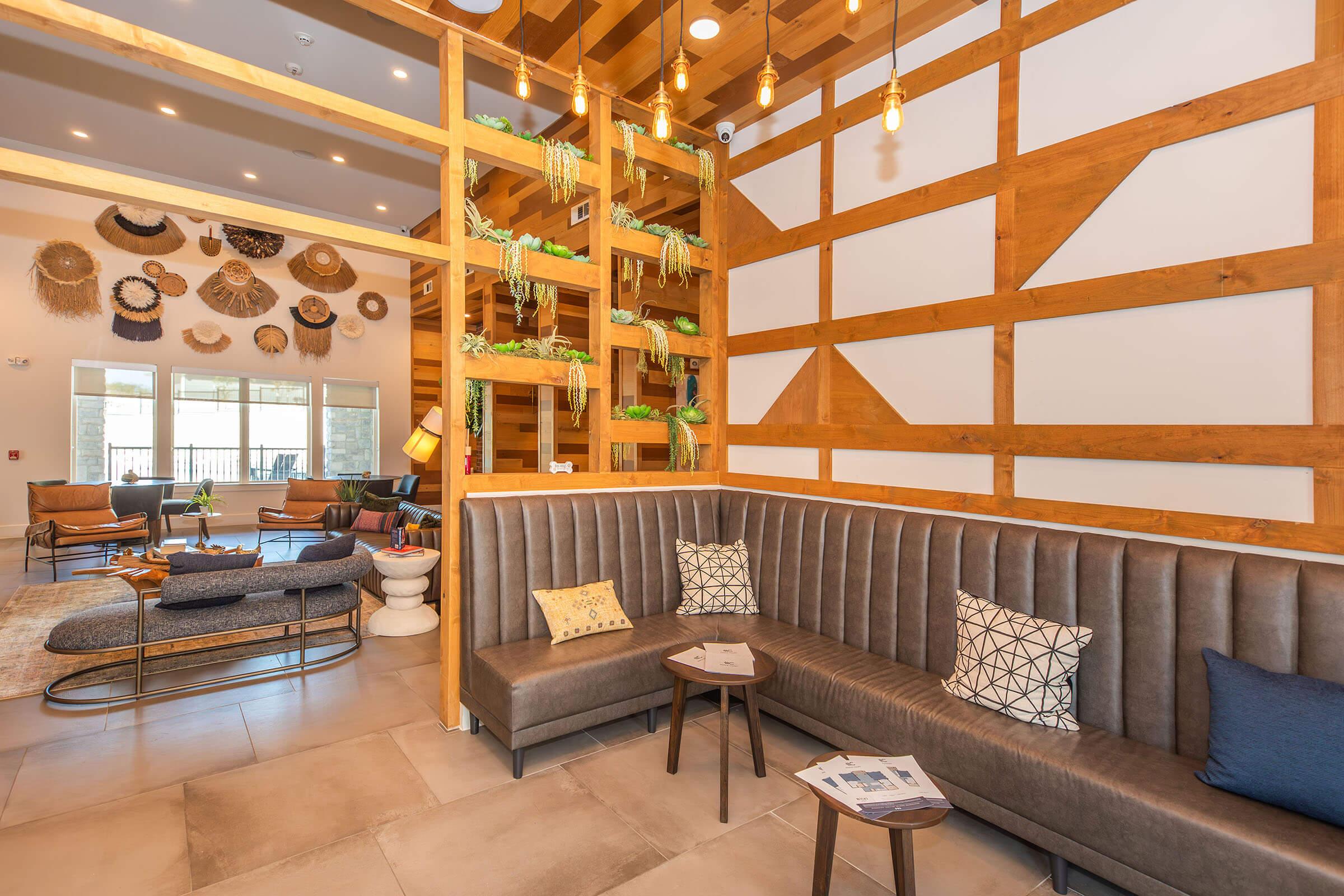 a living room filled with furniture and a large window