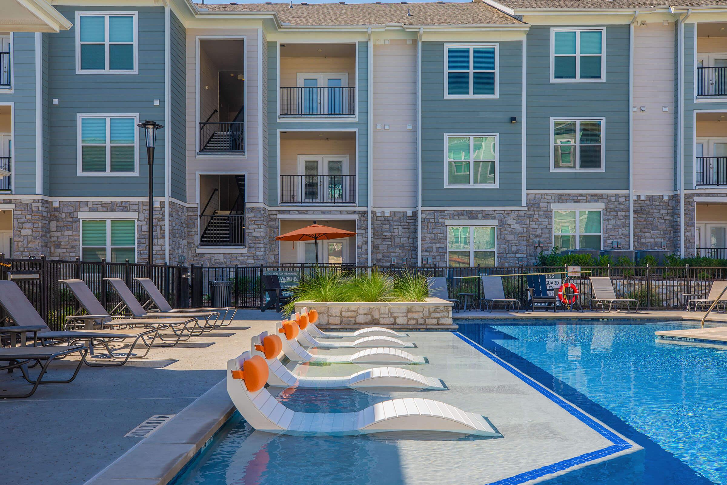 a pool in front of a building