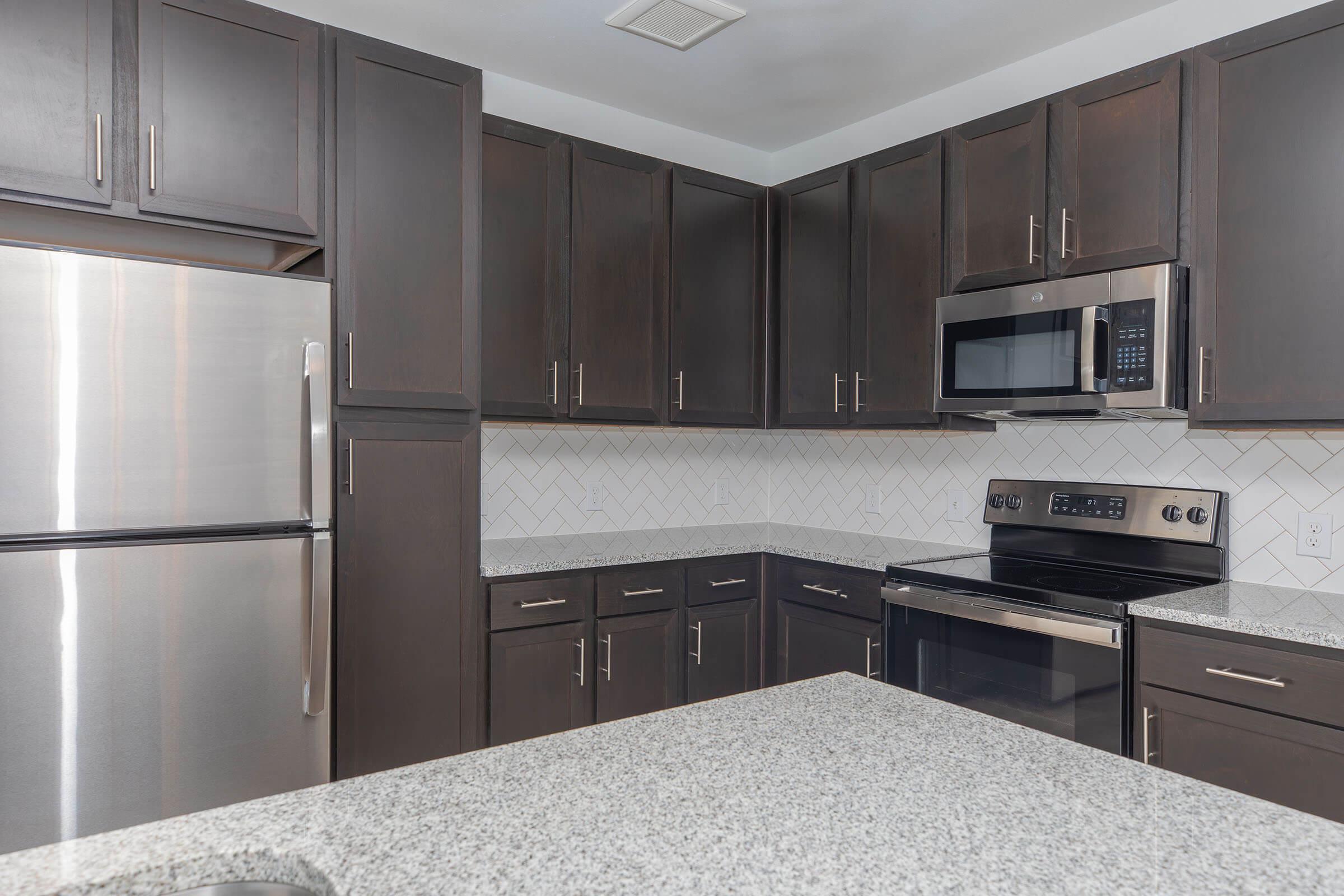 a modern kitchen with stainless steel appliances