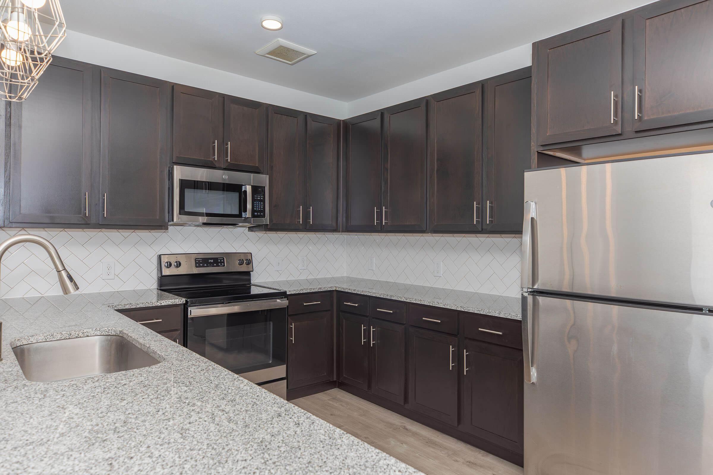 a modern kitchen with stainless steel appliances