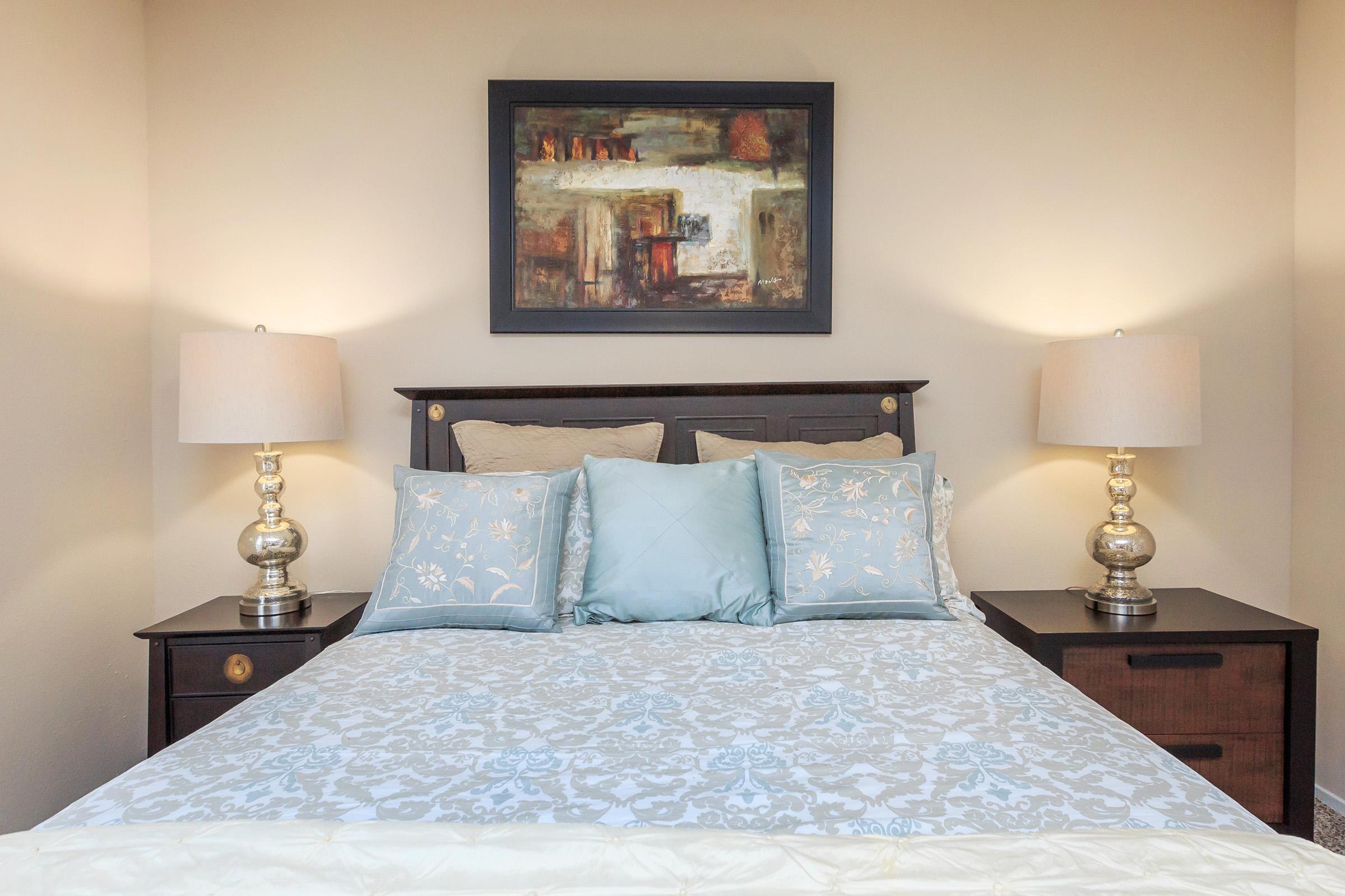 bedroom with a blue comforter