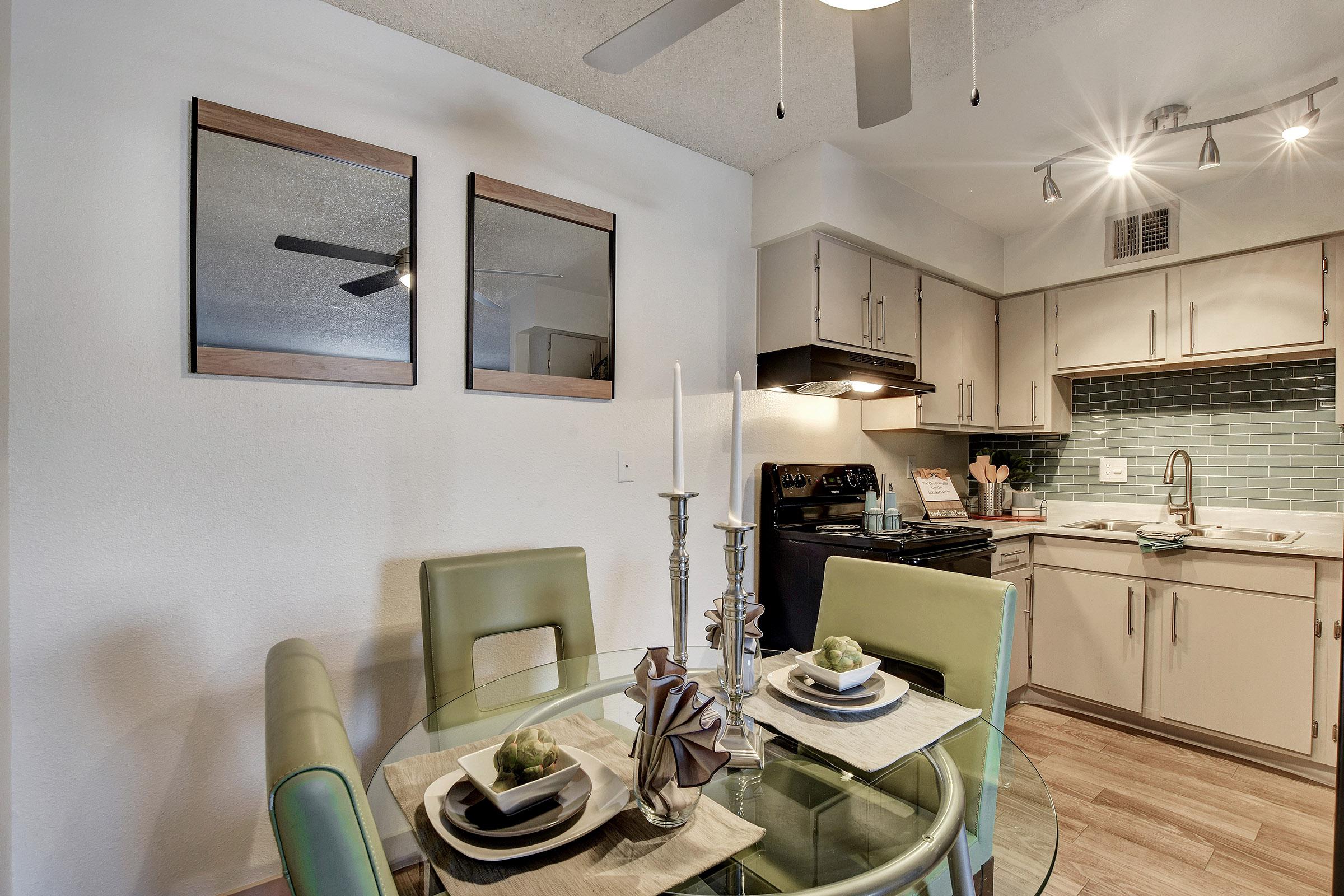 a kitchen with a sink and a mirror