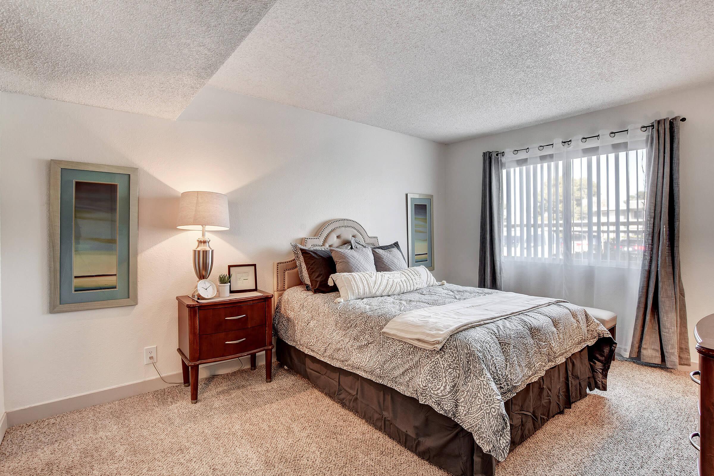 a bedroom with a bed in a hotel room
