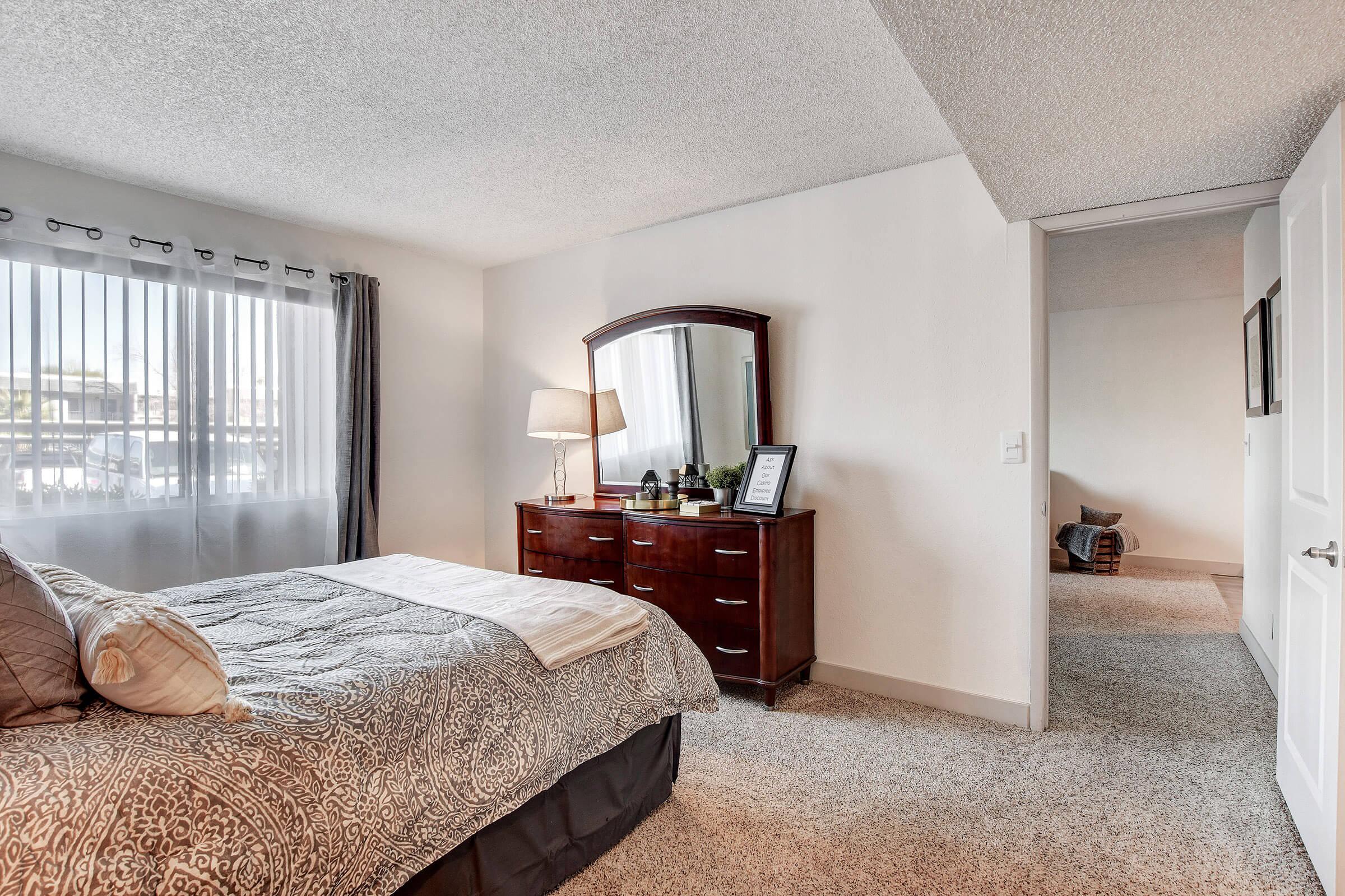 a bedroom with a large bed in a room