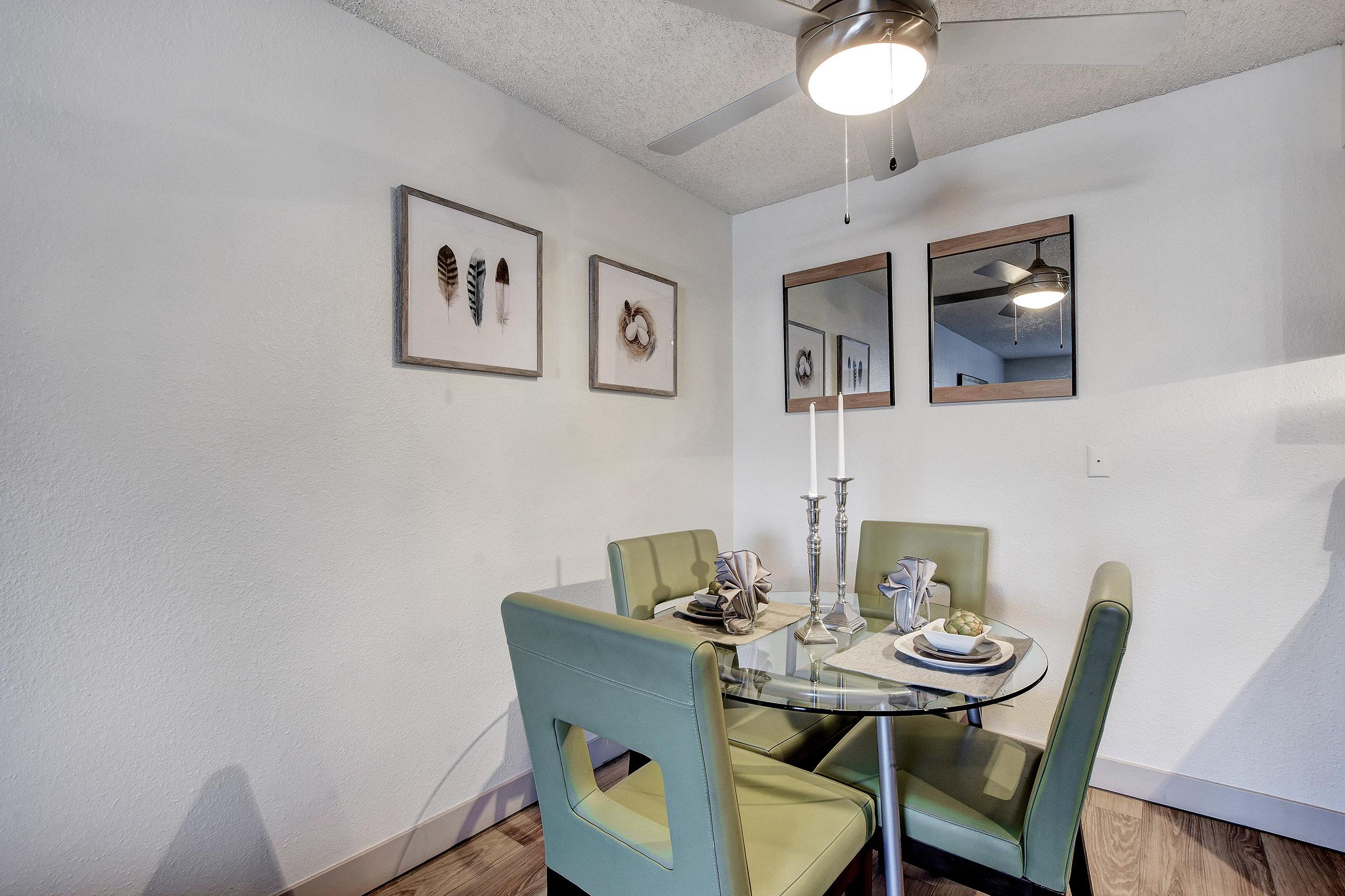 a room filled with furniture and a mirror