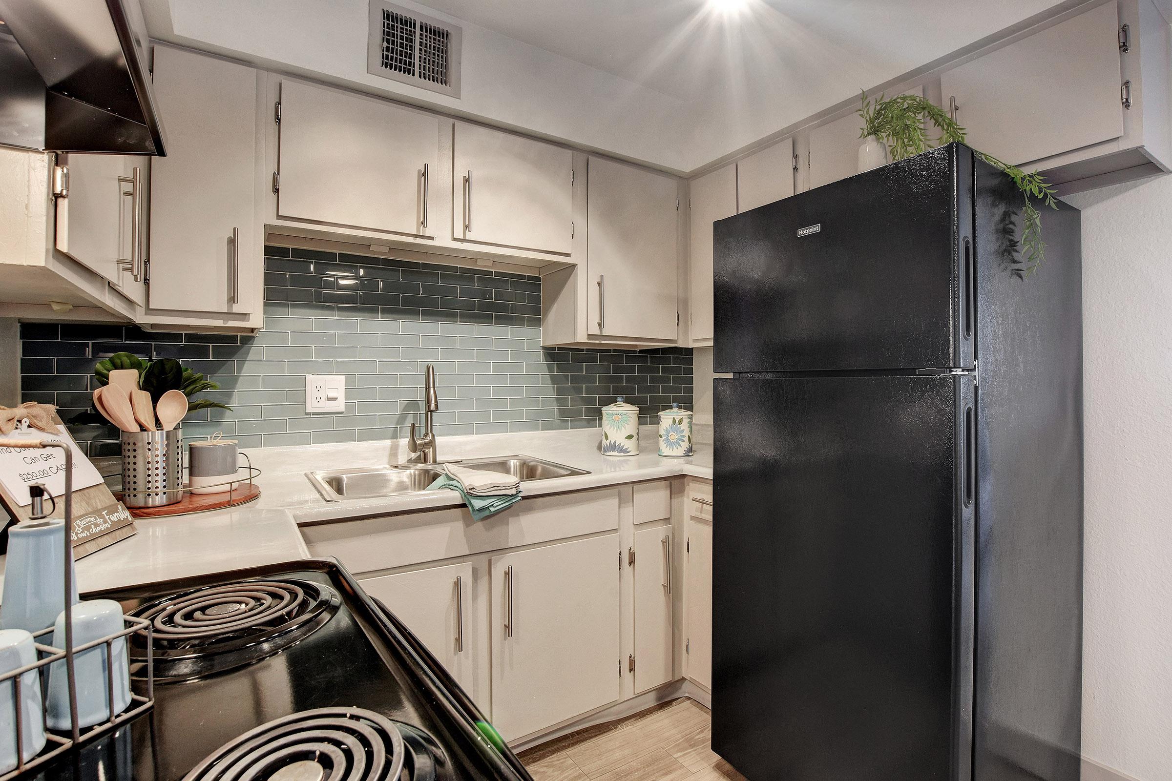 a large kitchen with stainless steel appliances