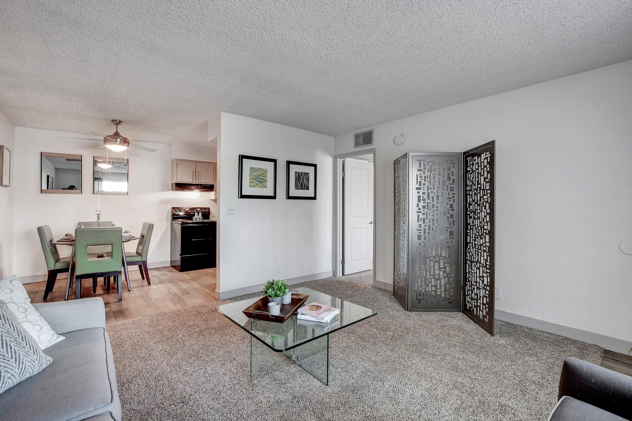 a living room filled with furniture and decor