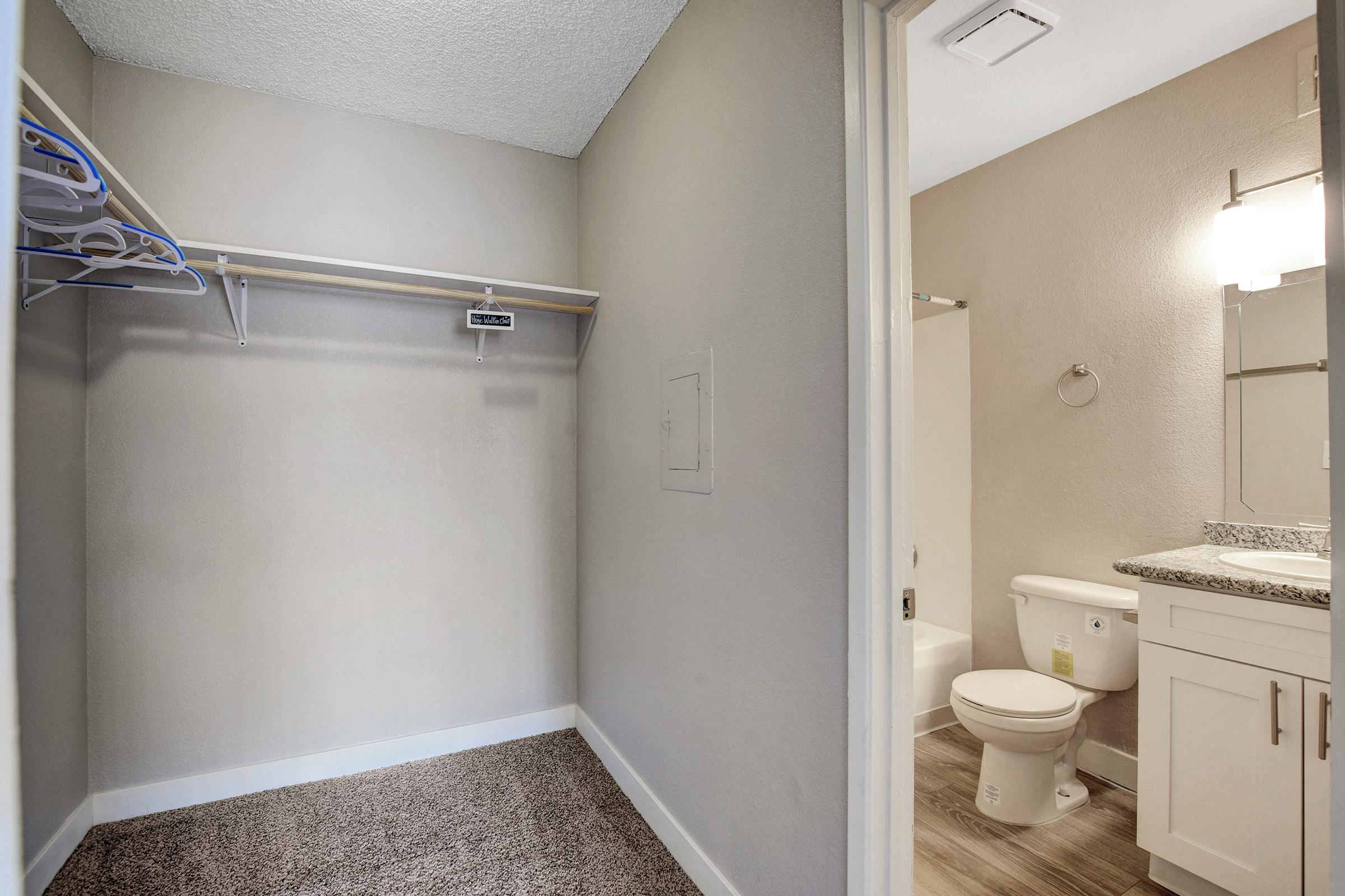 a white tub sitting next to a shower