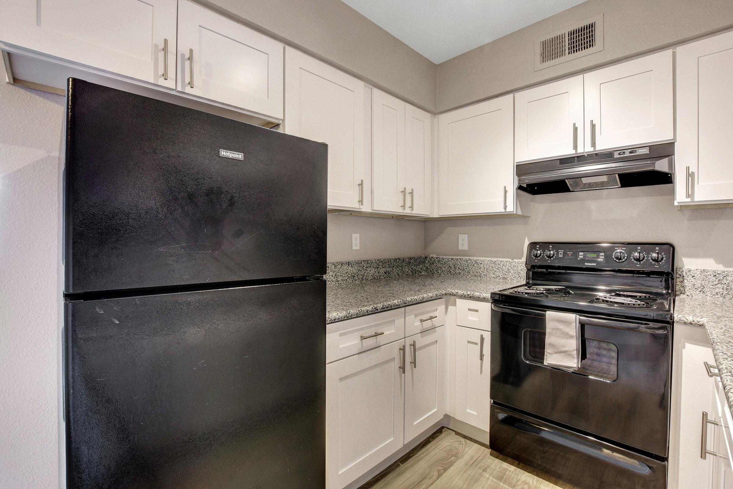 a stainless steel refrigerator in a kitchen