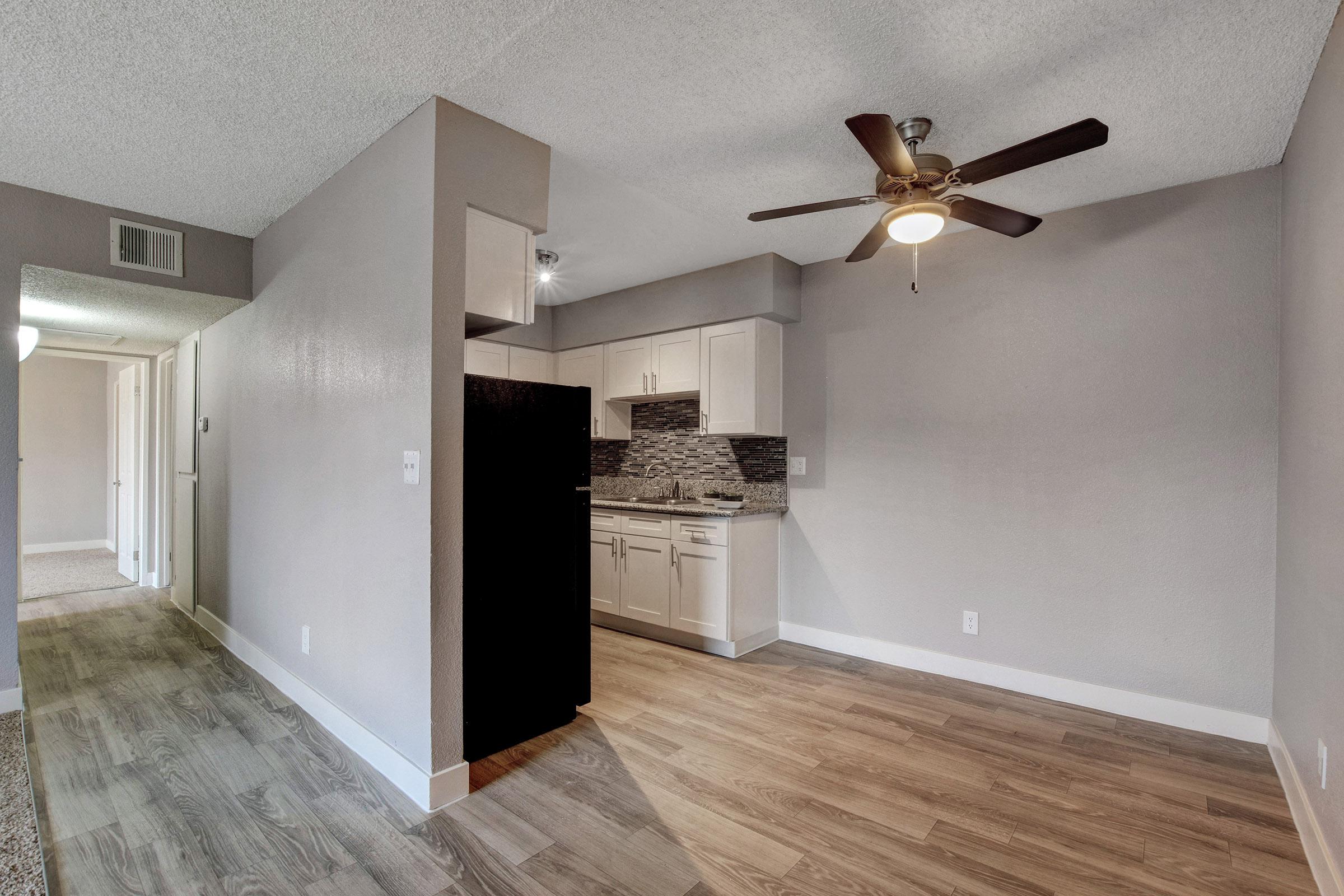a kitchen with a sink and a mirror