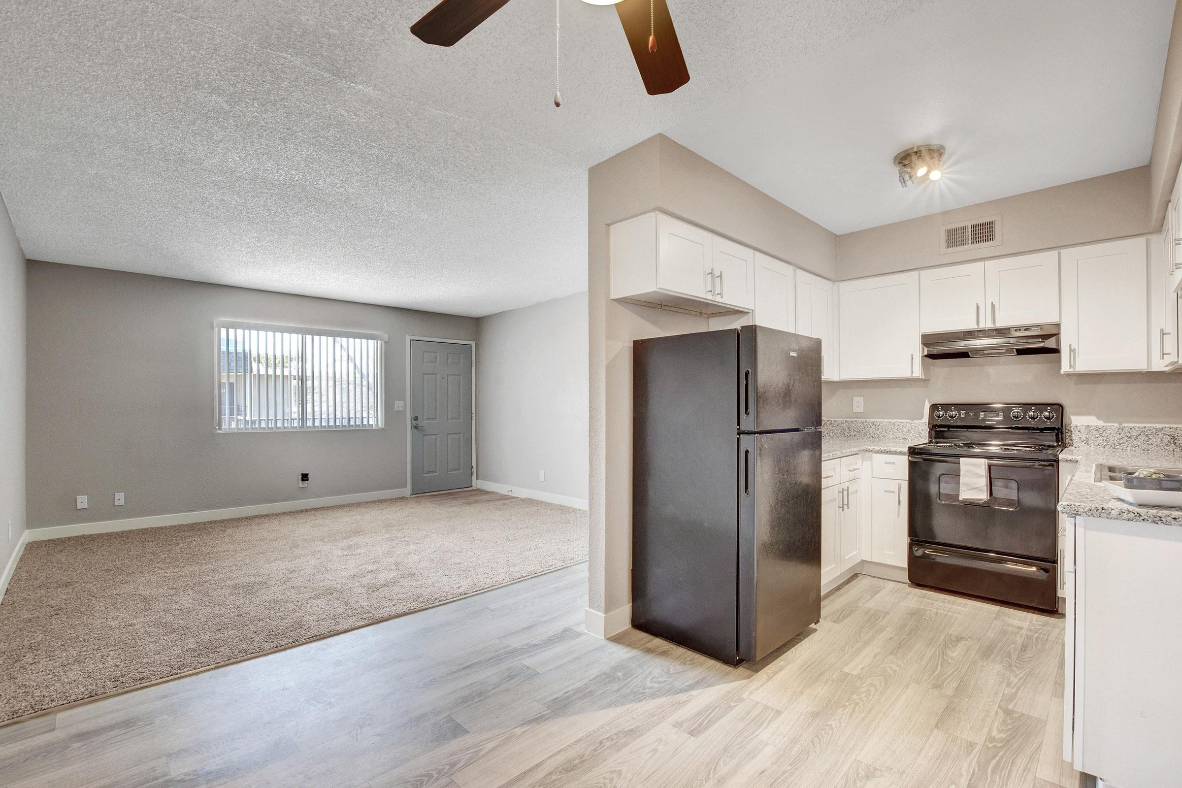 a large white refrigerator in a kitchen