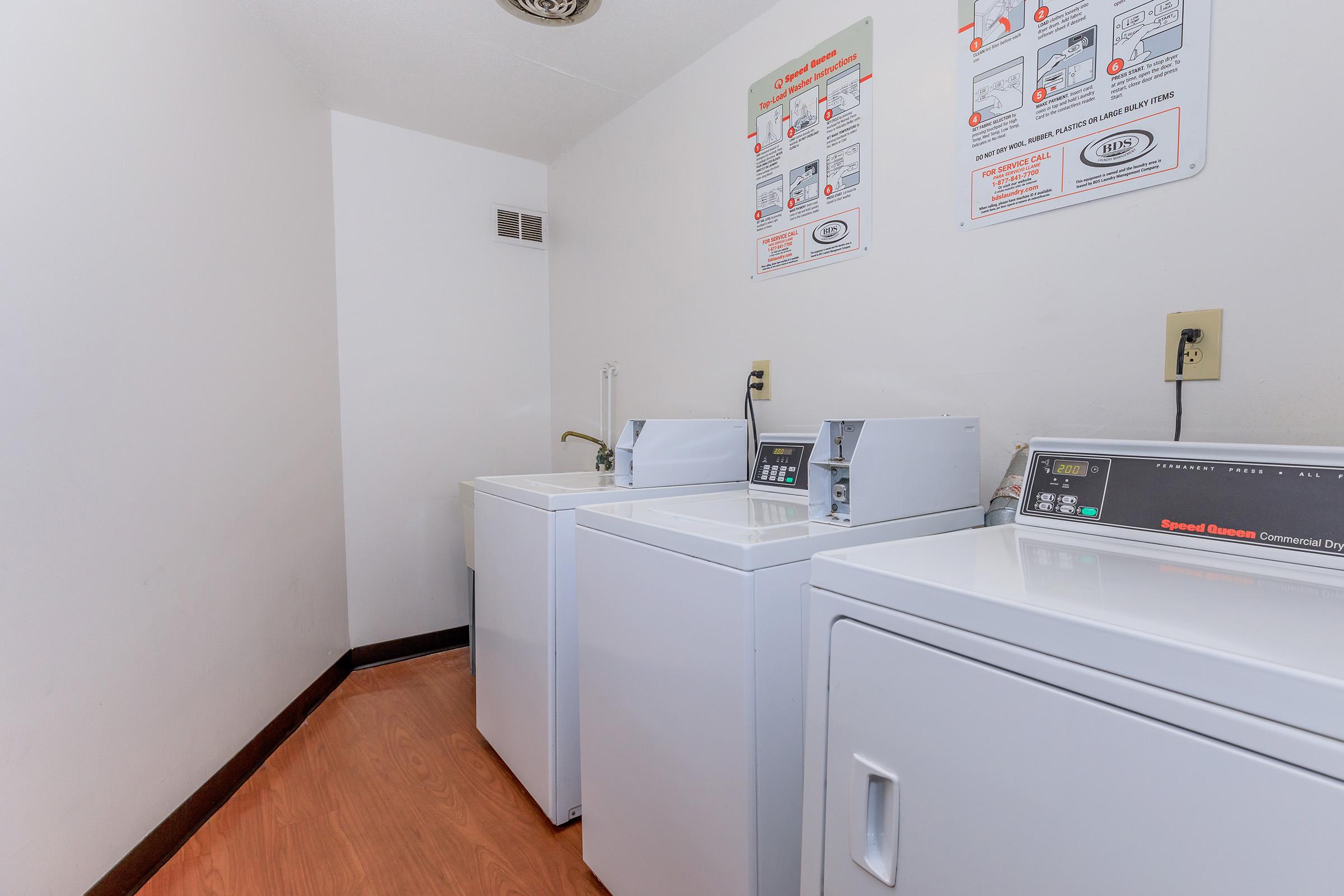 a kitchen with a sink and a refrigerator