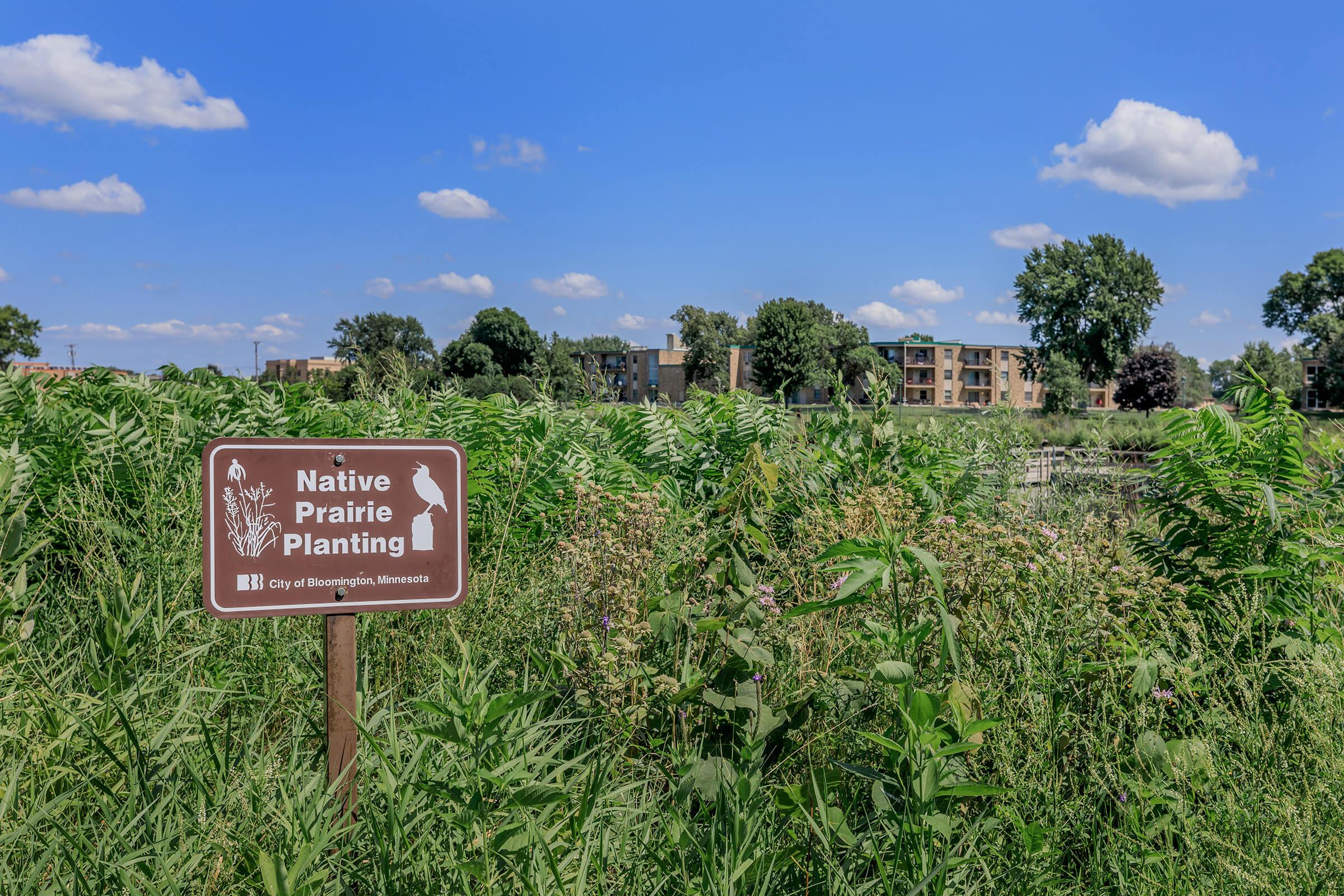 a sign in front of a tree