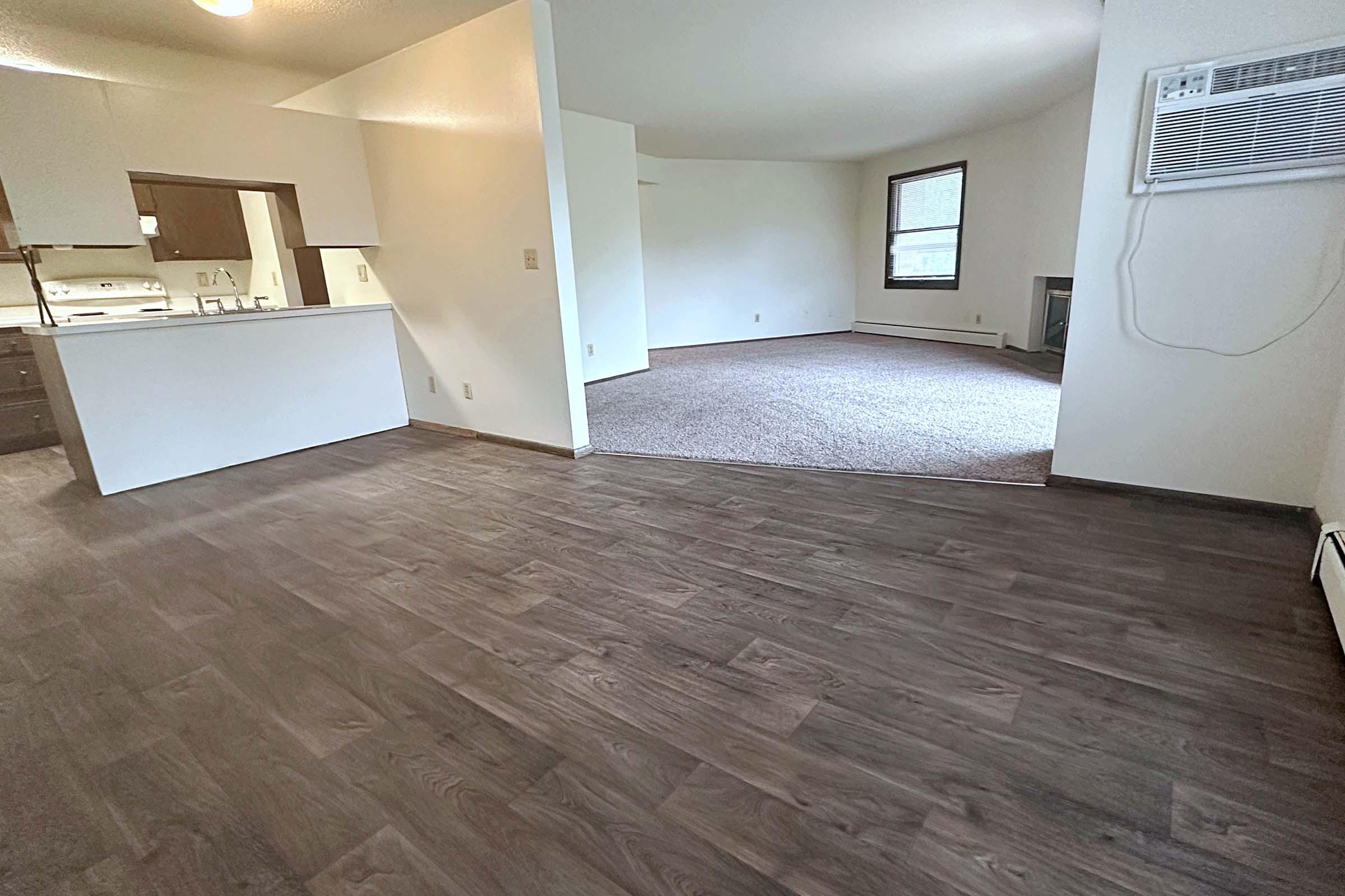 a large empty room with a wooden floor