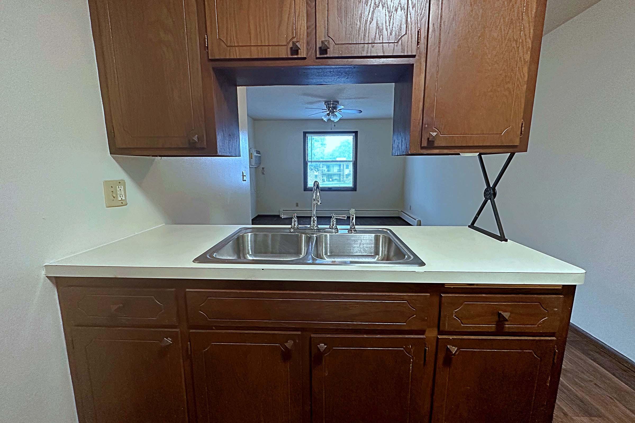 a stove top oven sitting inside of a kitchen