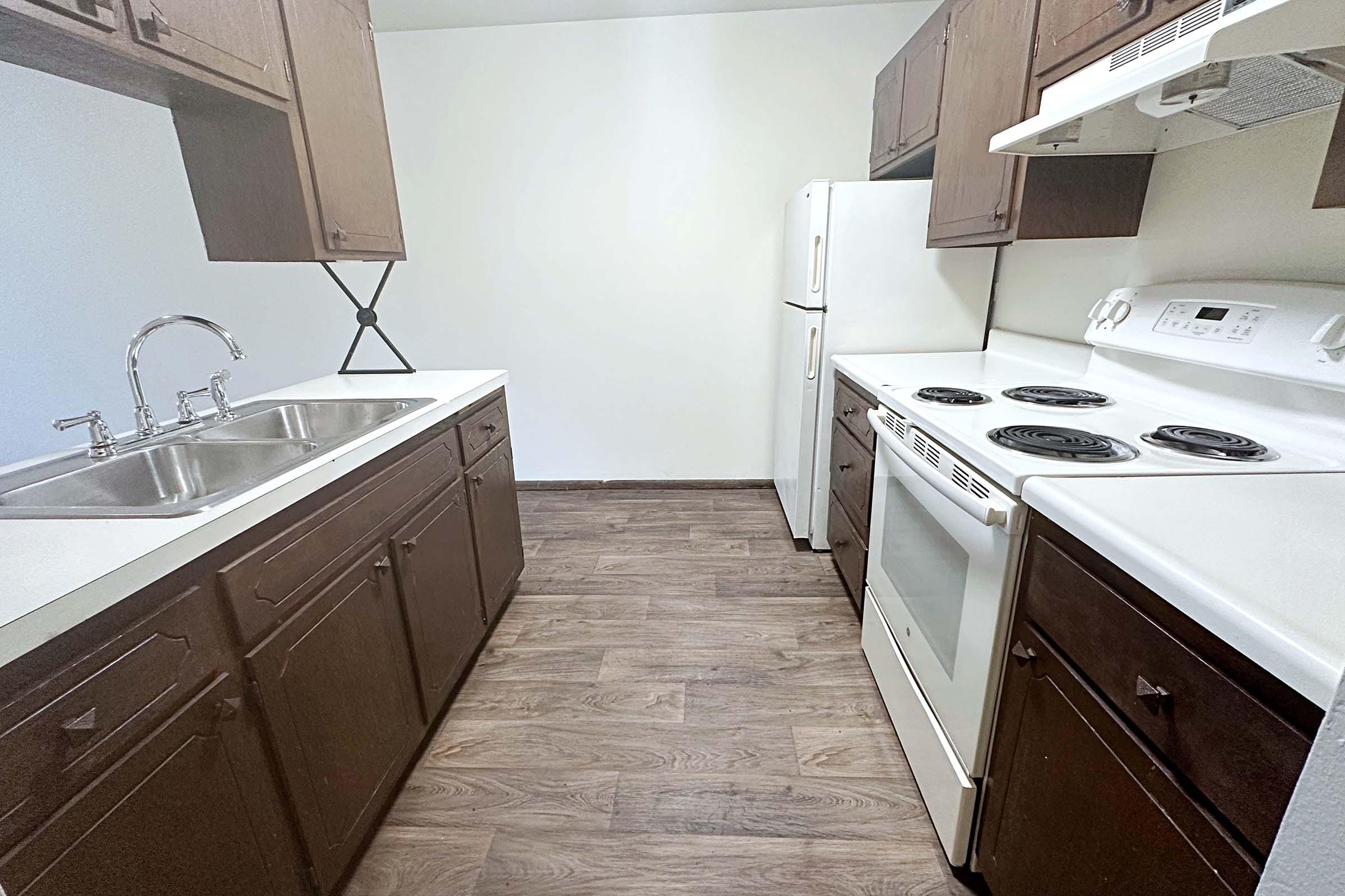 a kitchen with a sink and a microwave