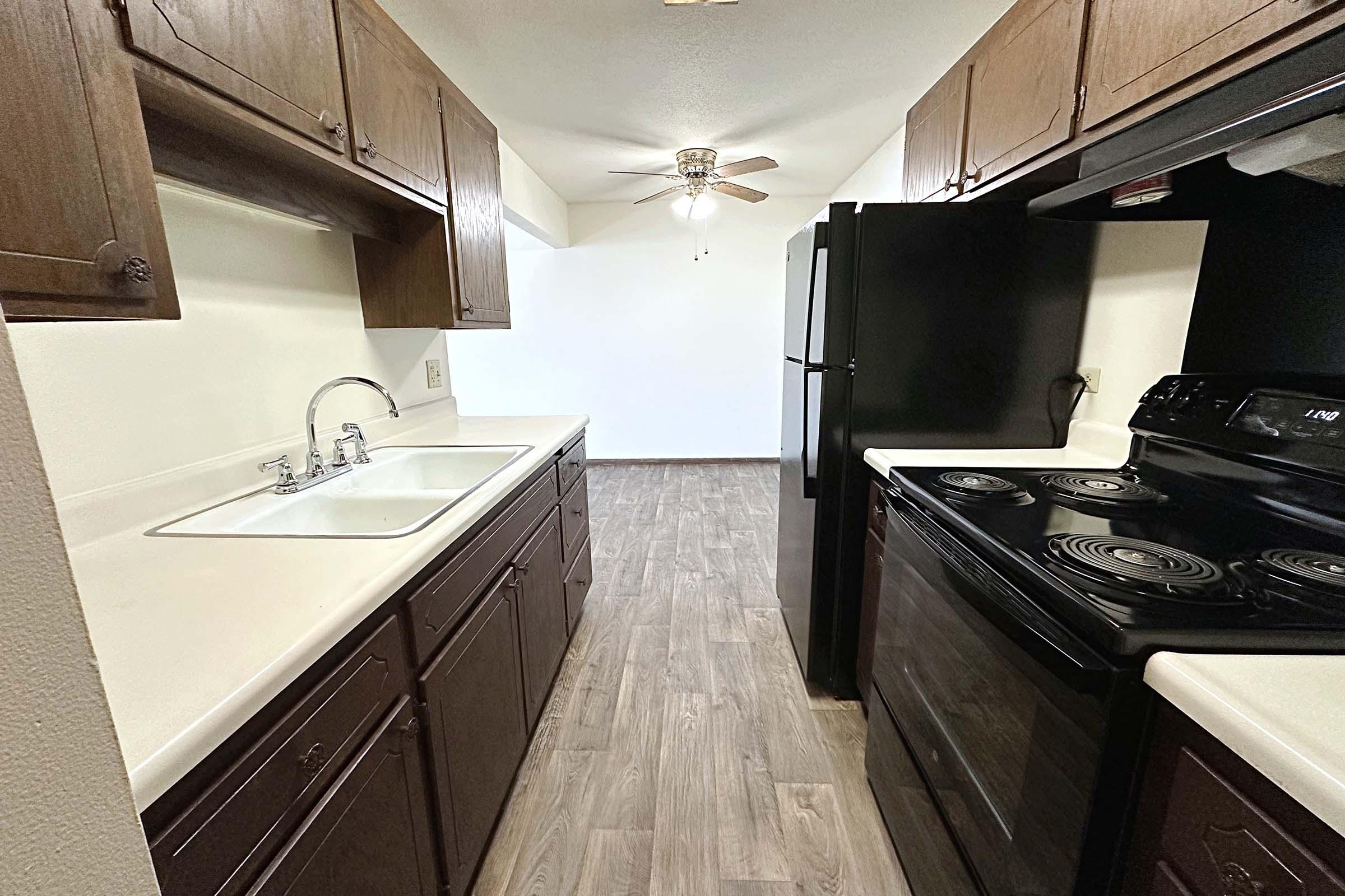 a kitchen with a stove top oven sitting inside of a building