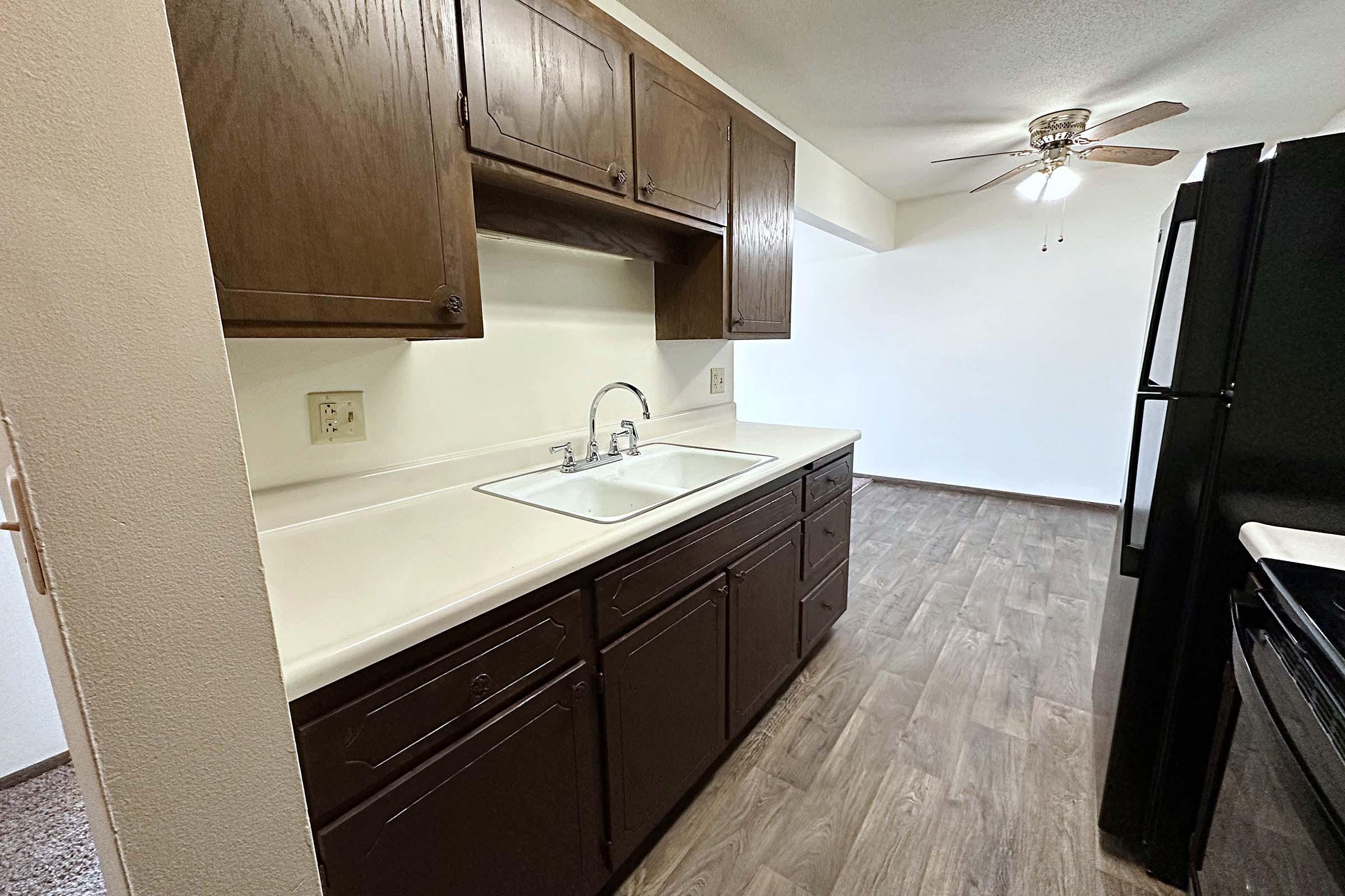 a kitchen with a stove and a sink