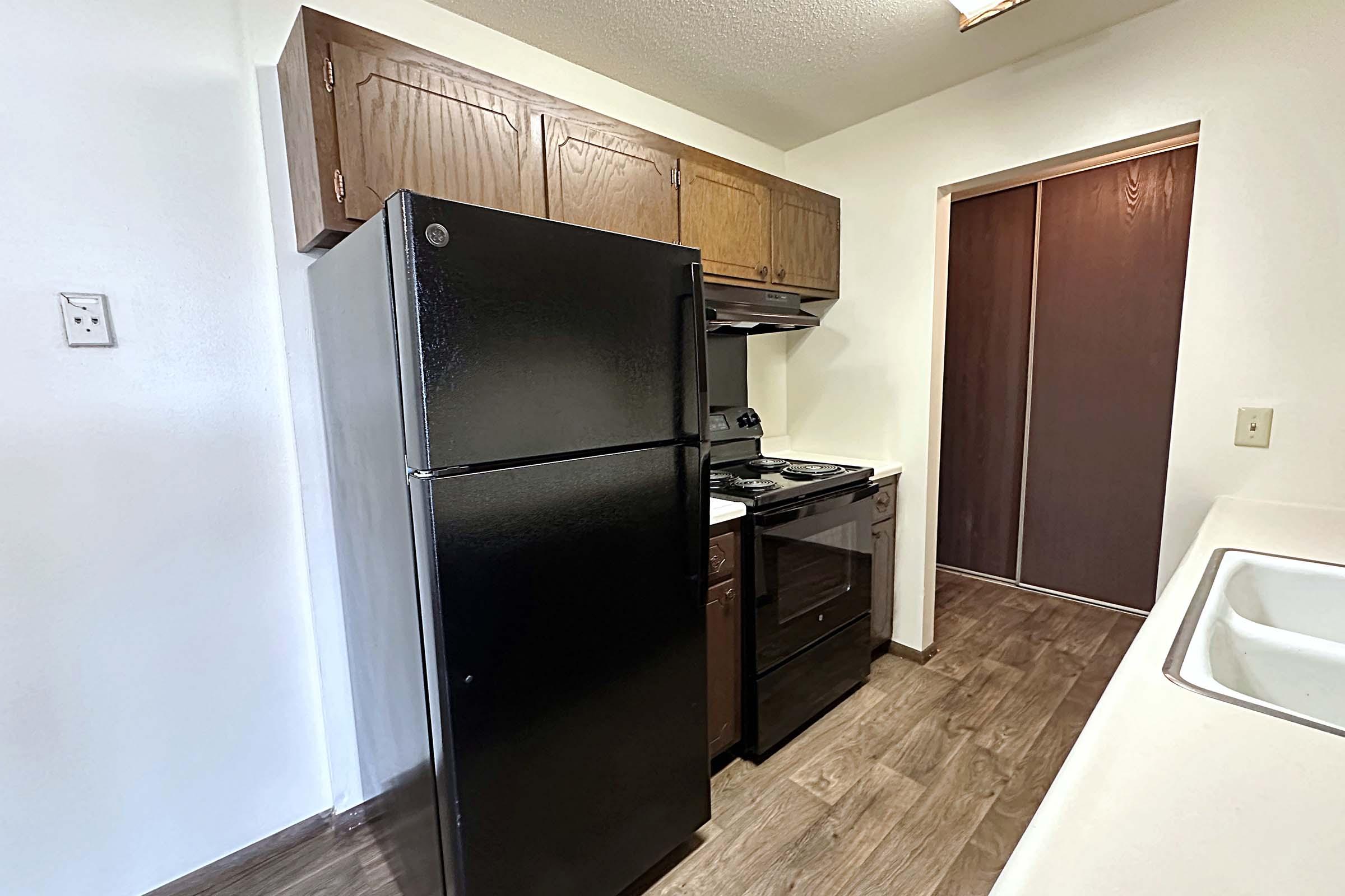 a stainless steel refrigerator in a kitchen