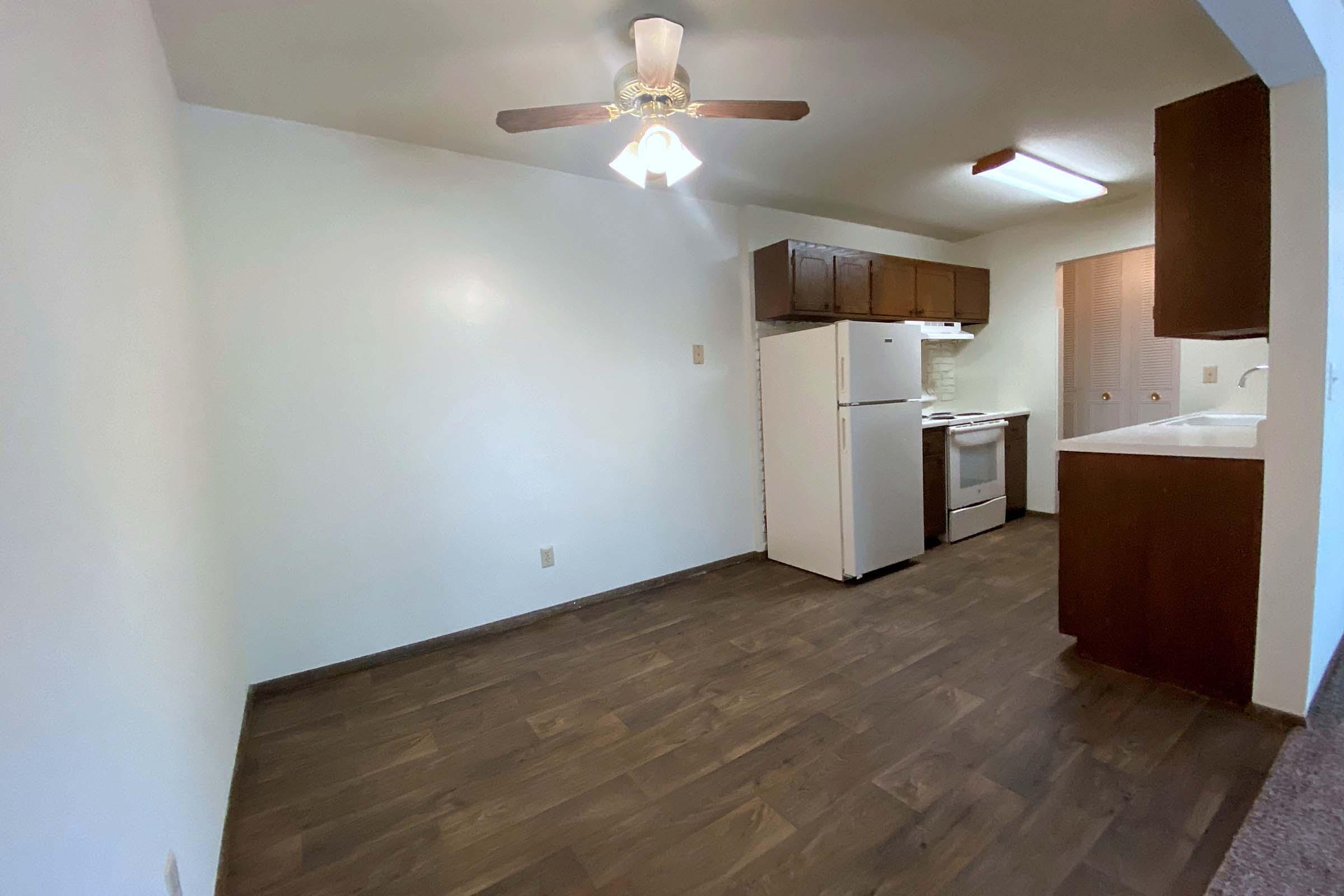 a kitchen with a wood floor