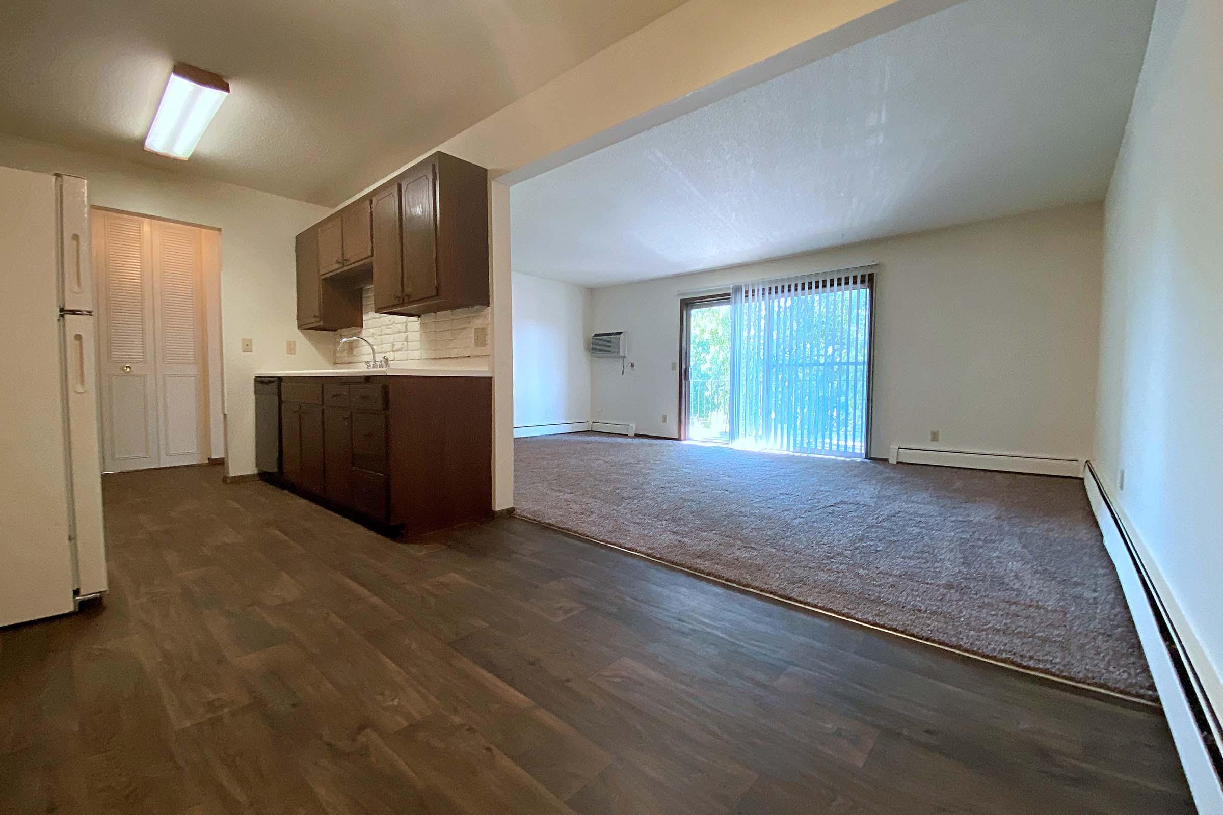 a large empty room with a wood floor