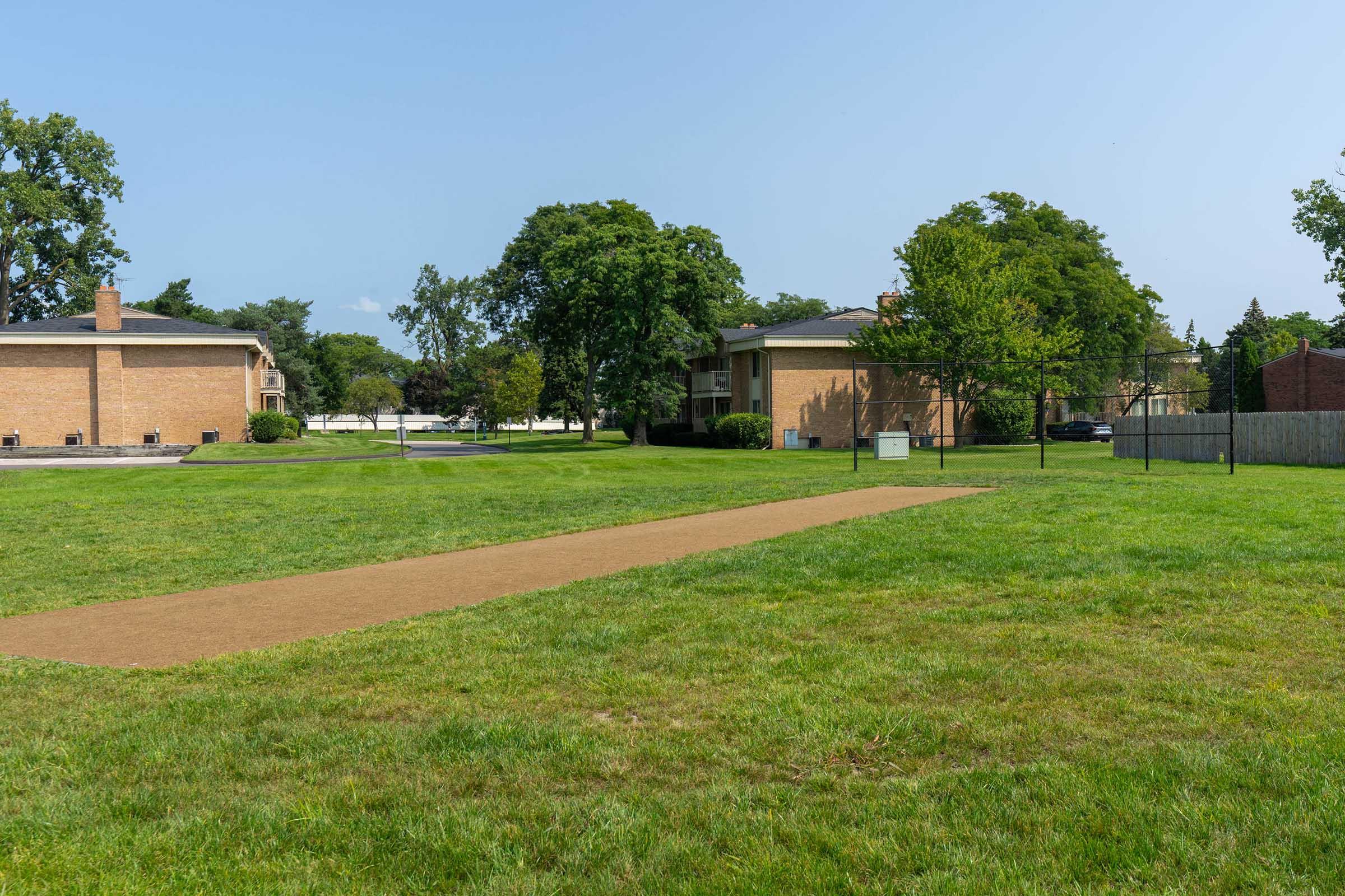 a building with a grassy field