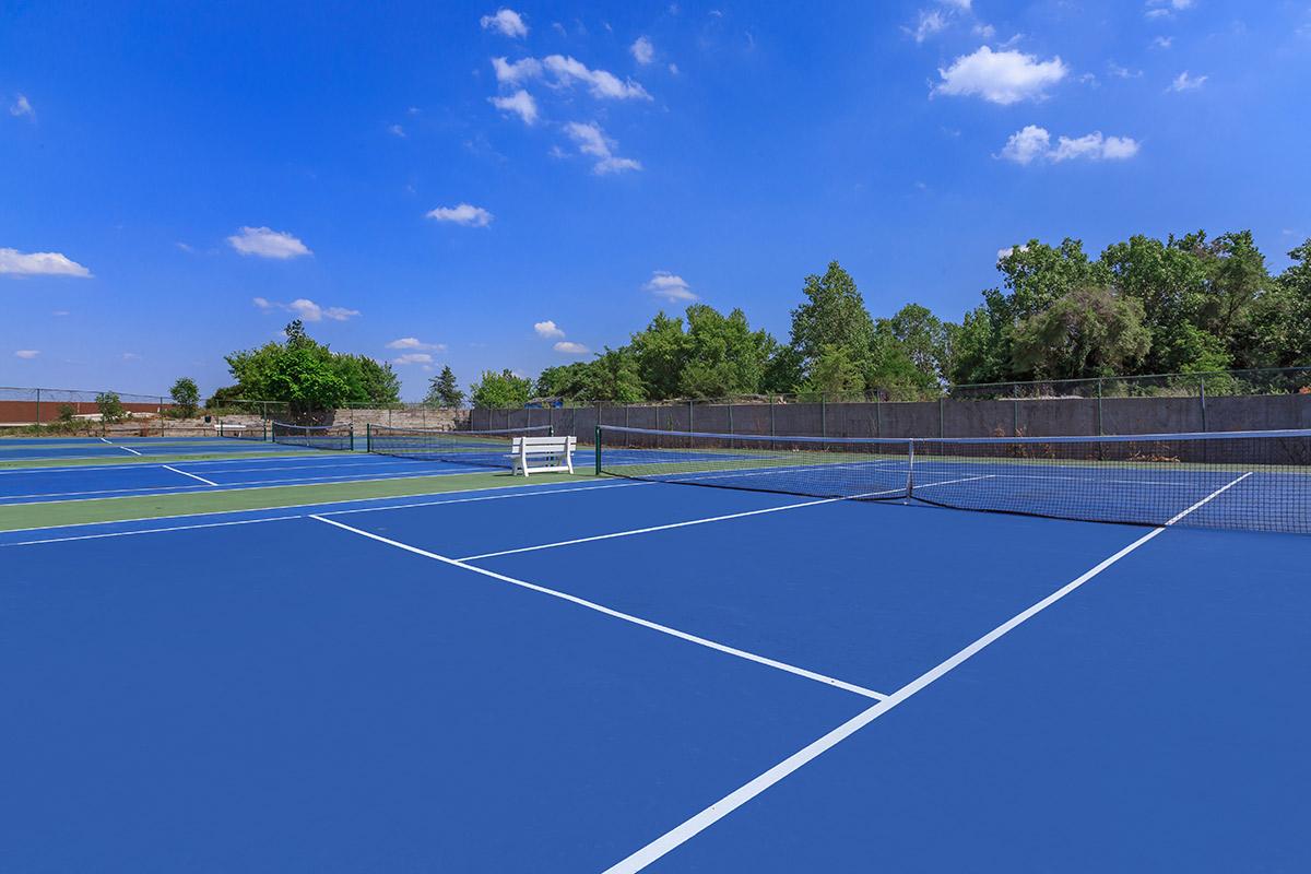 EIGHT TENNIS COURTS