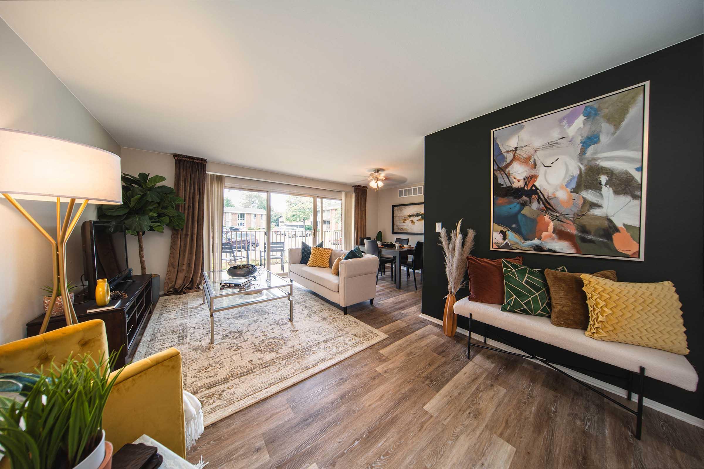 a living room filled with furniture and a fireplace