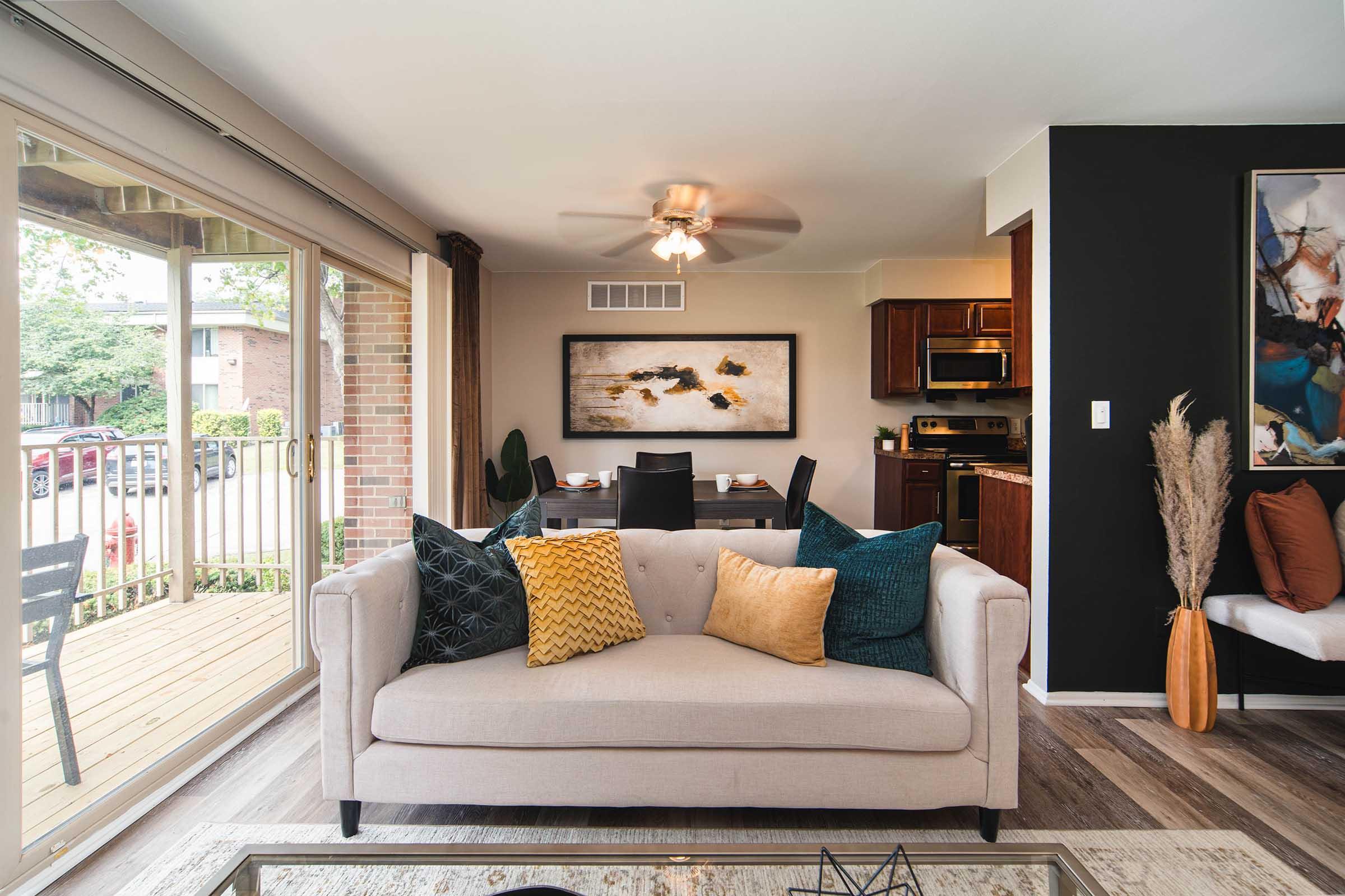 a living room filled with furniture and a flat screen tv