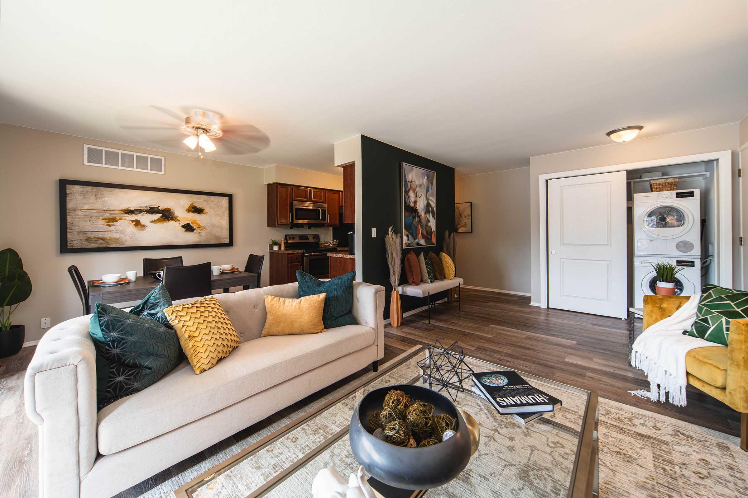 a living room filled with furniture and a fireplace