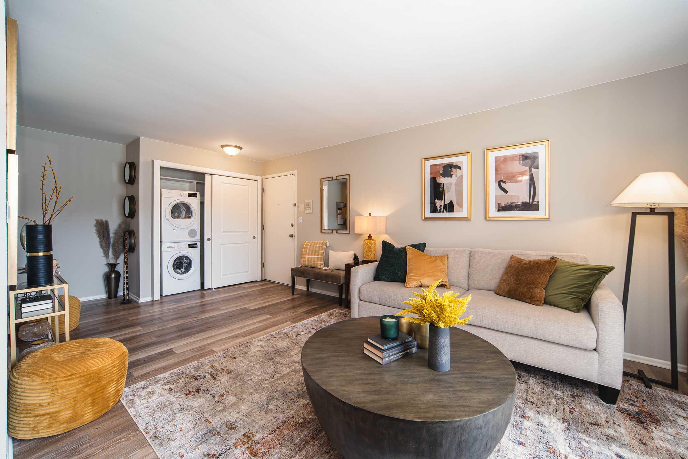 a living room filled with furniture and a flat screen tv