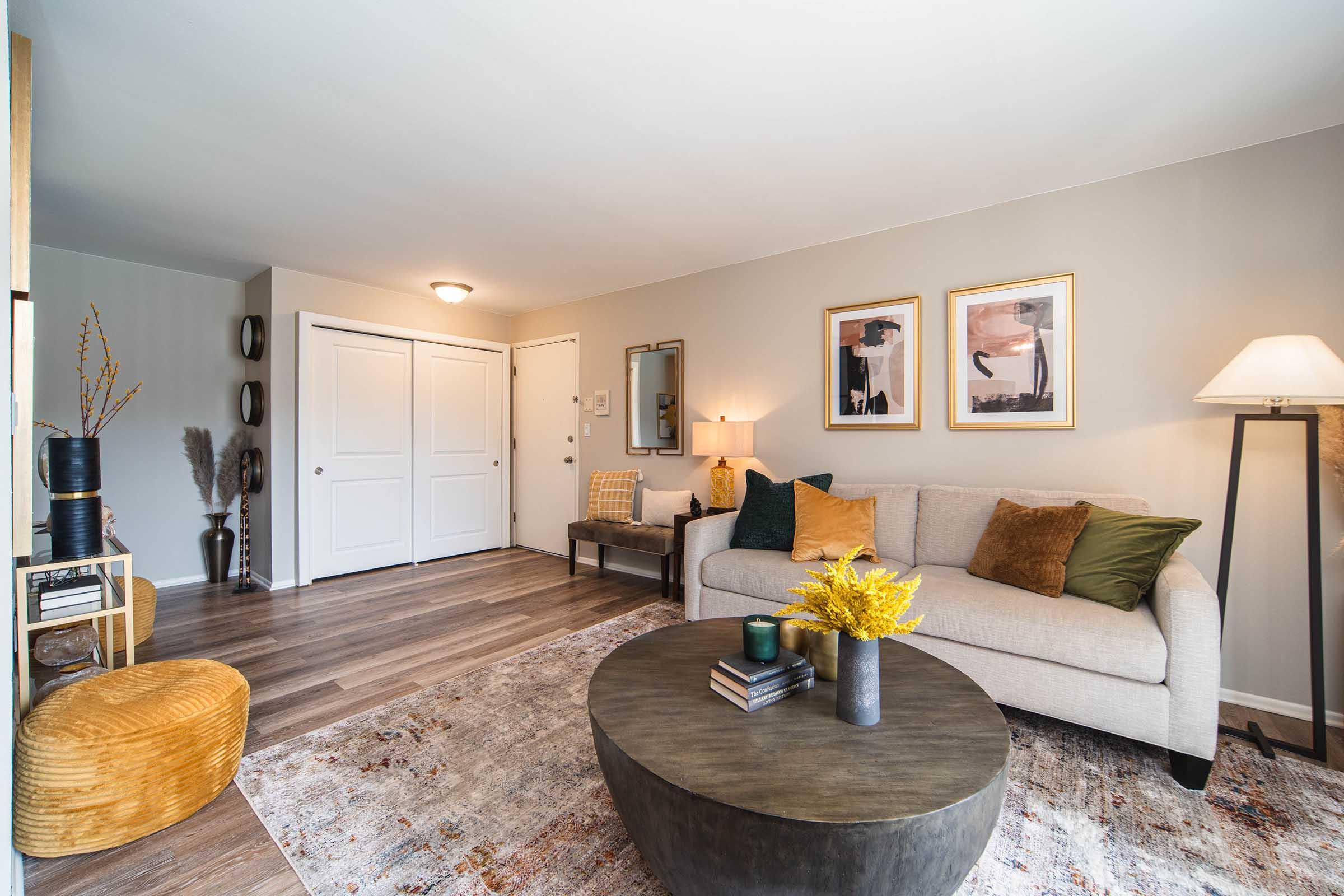 a living room filled with furniture and a flat screen tv