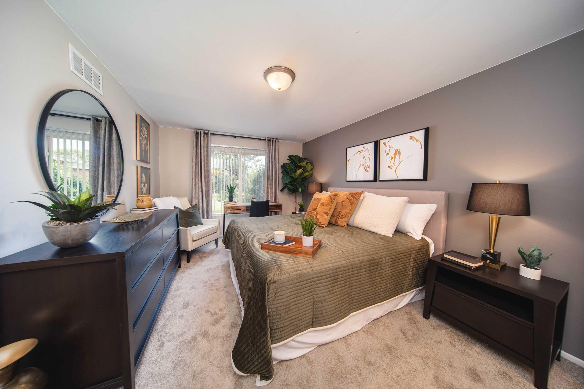 a living room filled with furniture and a flat screen tv