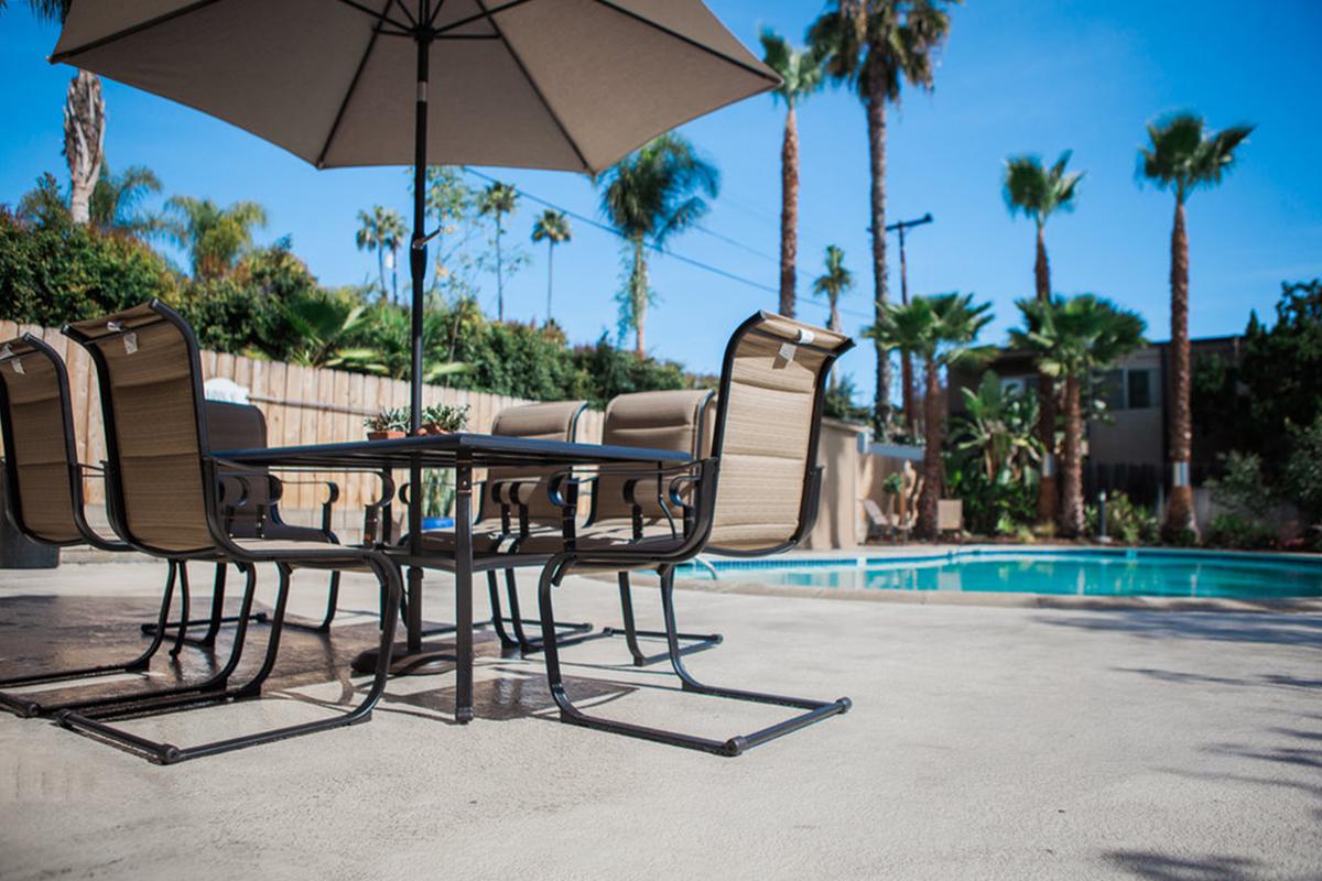 a table topped with a blue umbrella