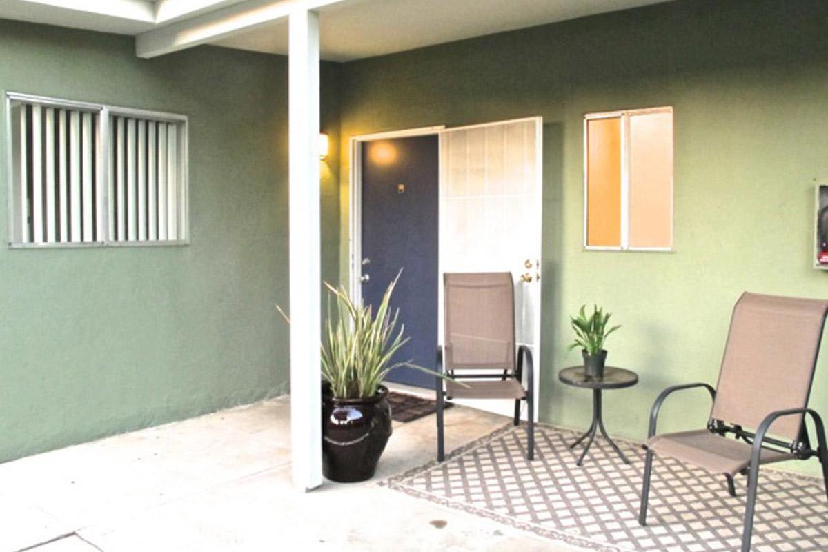 a chair sitting in front of a building