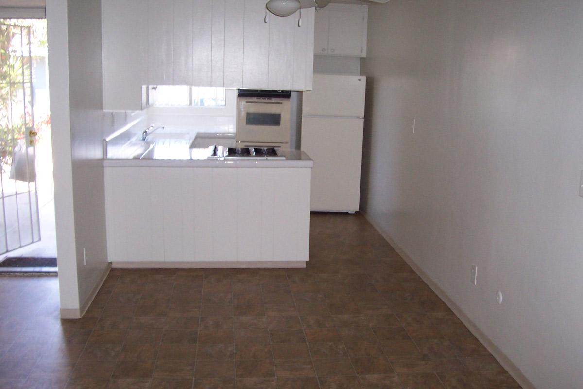 a large white refrigerator in a kitchen