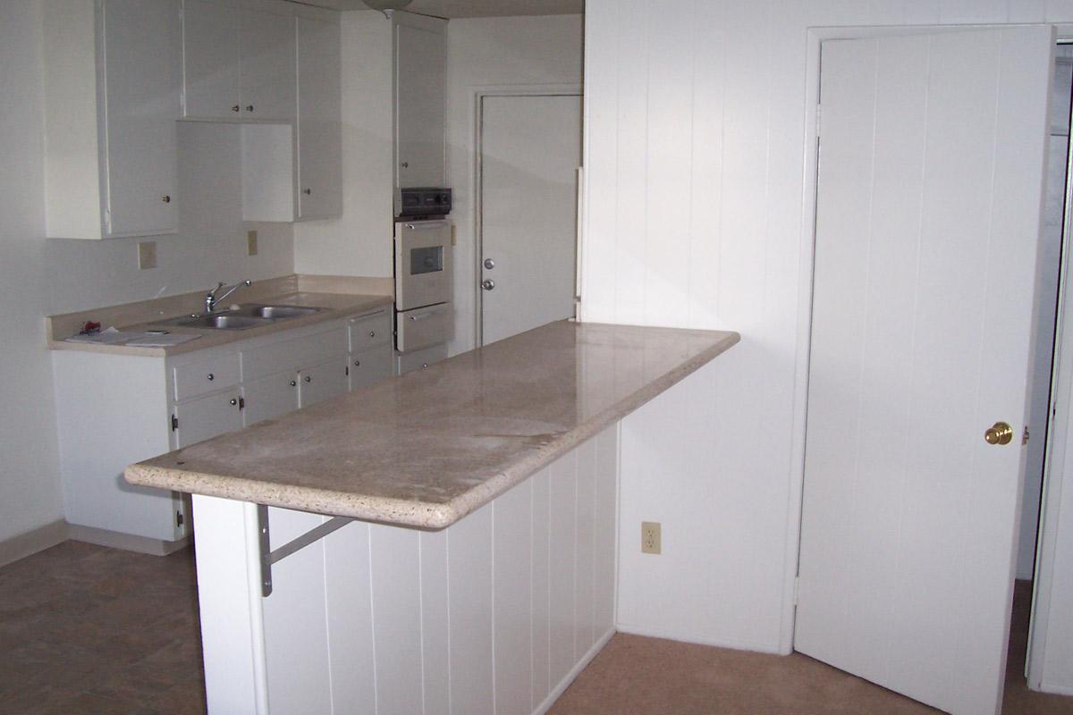 a kitchen with a sink and a microwave