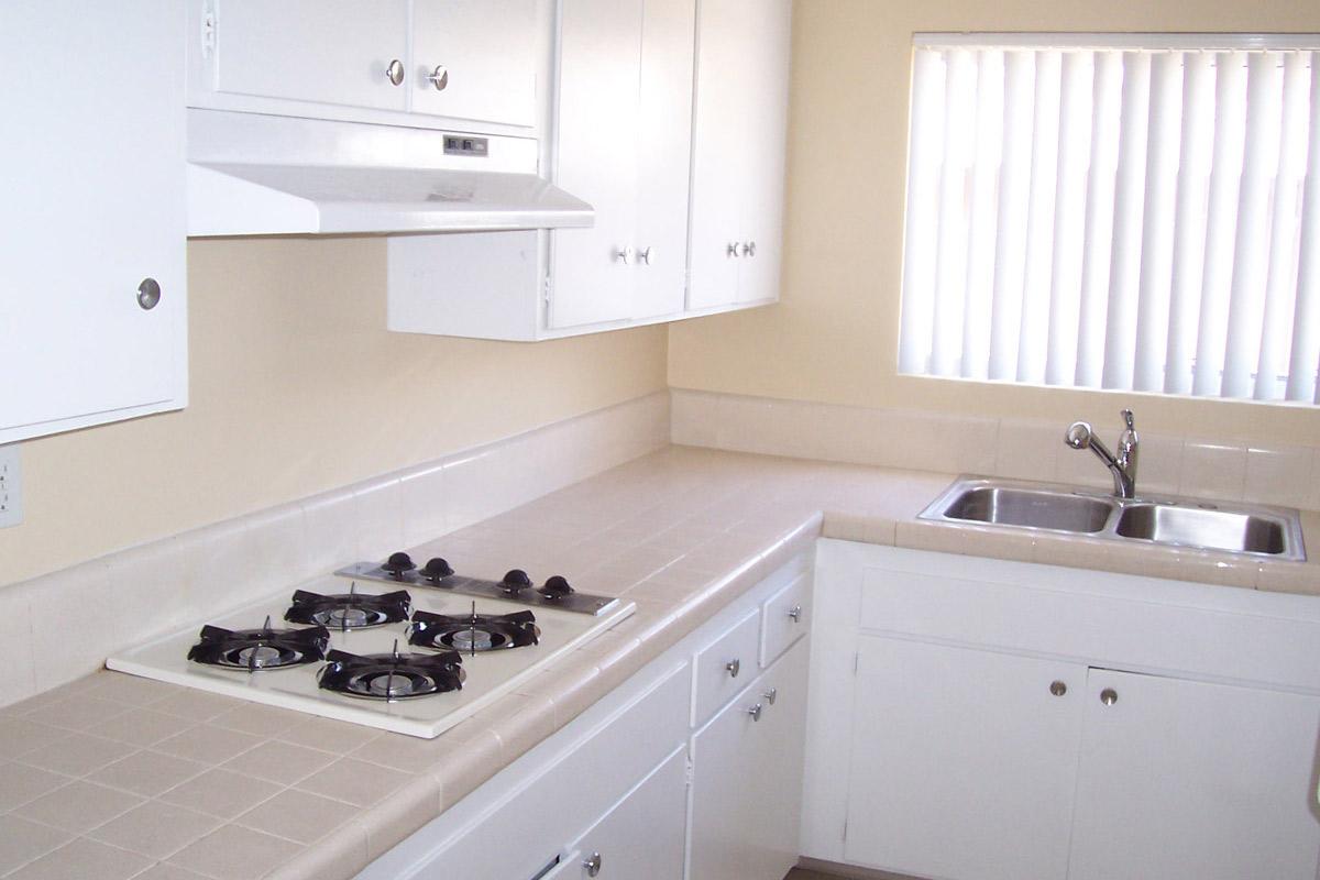 a kitchen with a stove and a sink