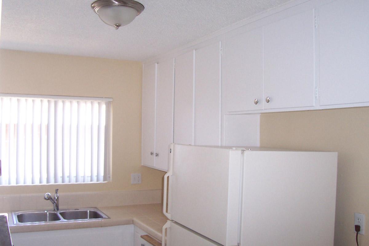 a kitchen with a sink and a window